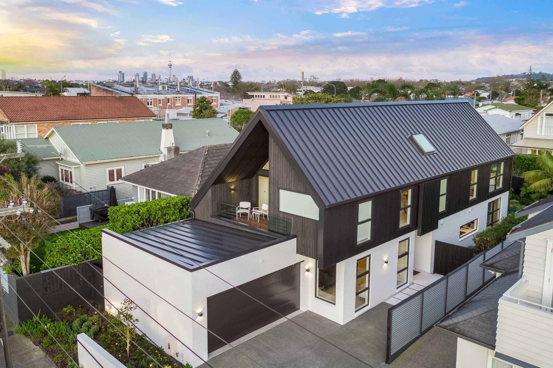 The incredibly compact site is sandwiched between two neighbouring properties, but the home is designed to enjoy privacy and harbour views.