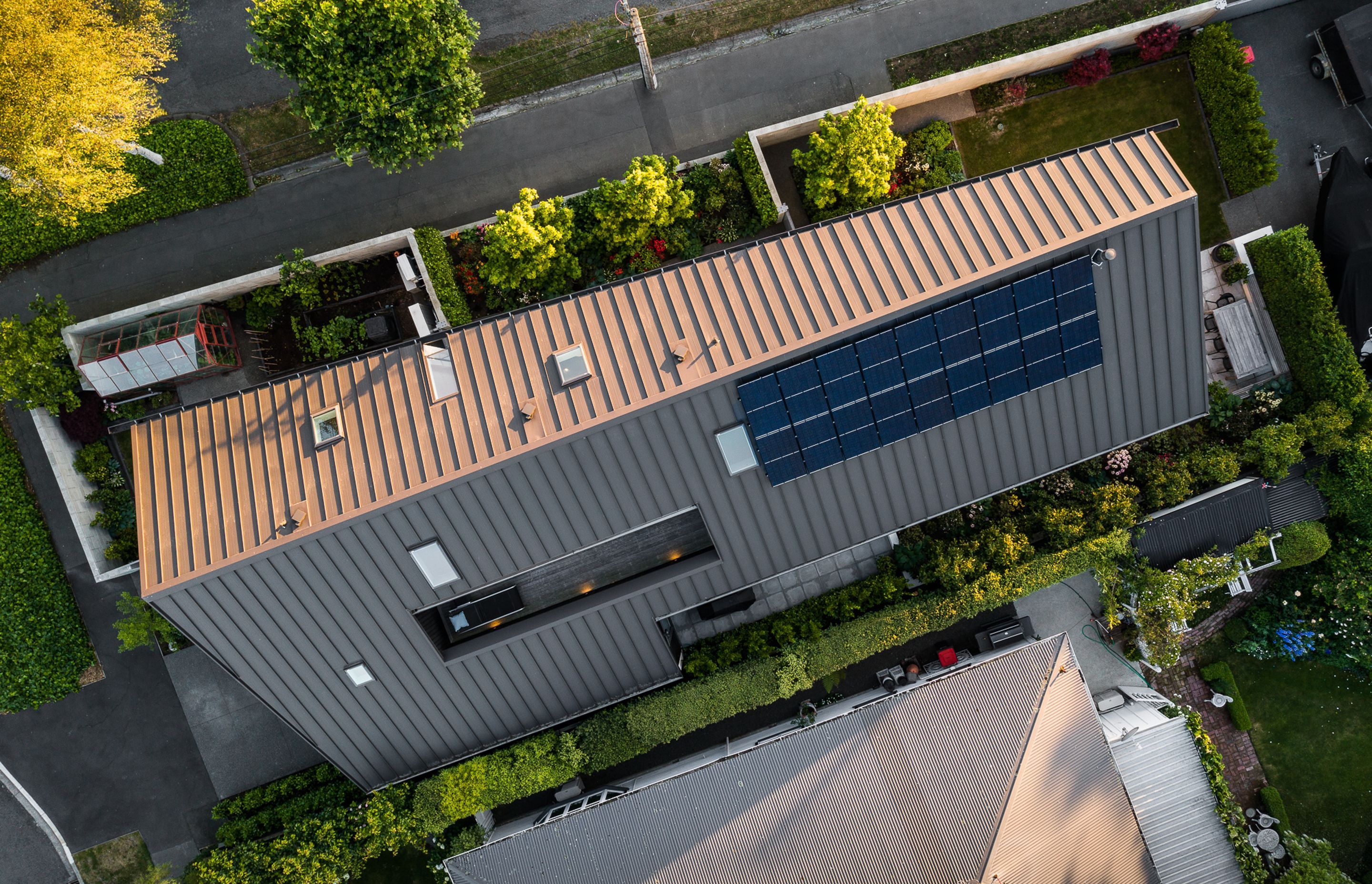 To accomodate the small site and add a bit of architectural flair, the roof pitch was designed to be unbalanced.