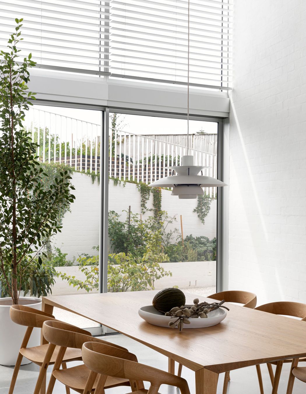 At the rear of the dining space a sheltered courtyard contains a kitchen garden, which can also be accessed by the guest suite.