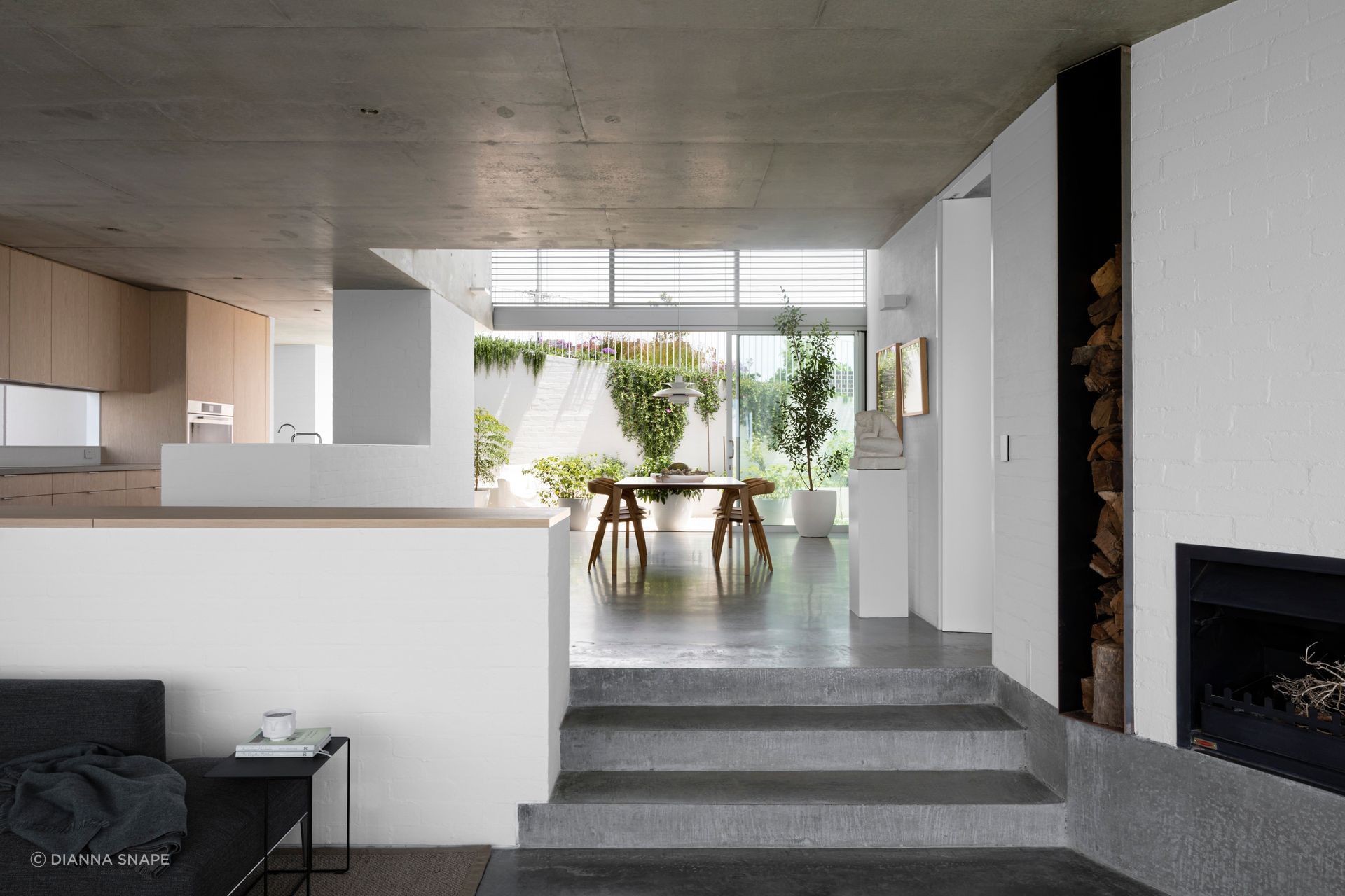 The kitchen and dining drops down to a sunken lounge.