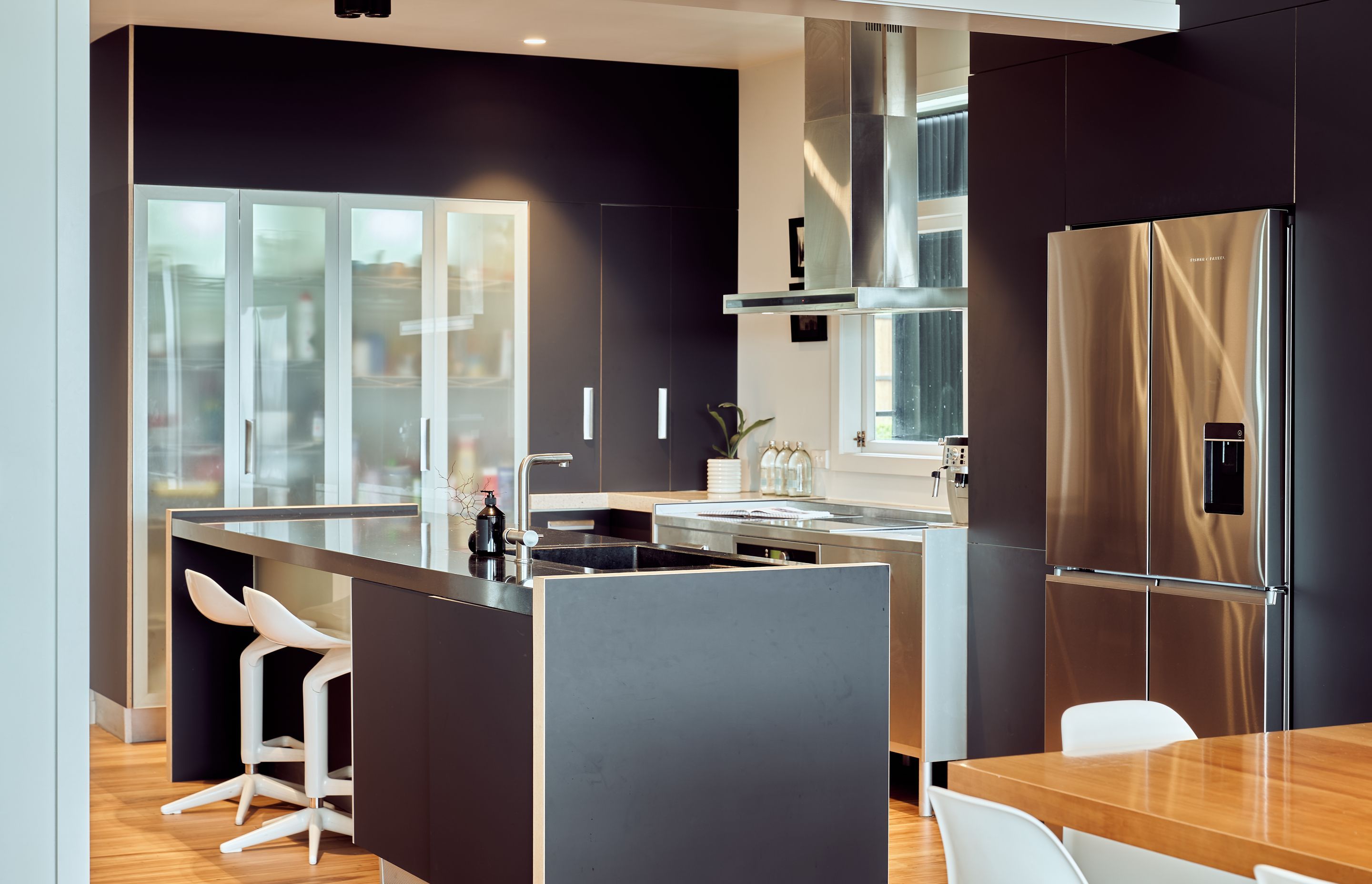 The dark, recessive kitchen is a show-stopping centrepiece.