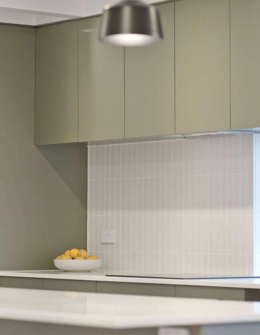 "Many of the other projects we’ve completed recently have had Hamptons-style kitchens with white shaker profile cupboards and drawers, but these homeowners have done something a little bit different which is great to see."