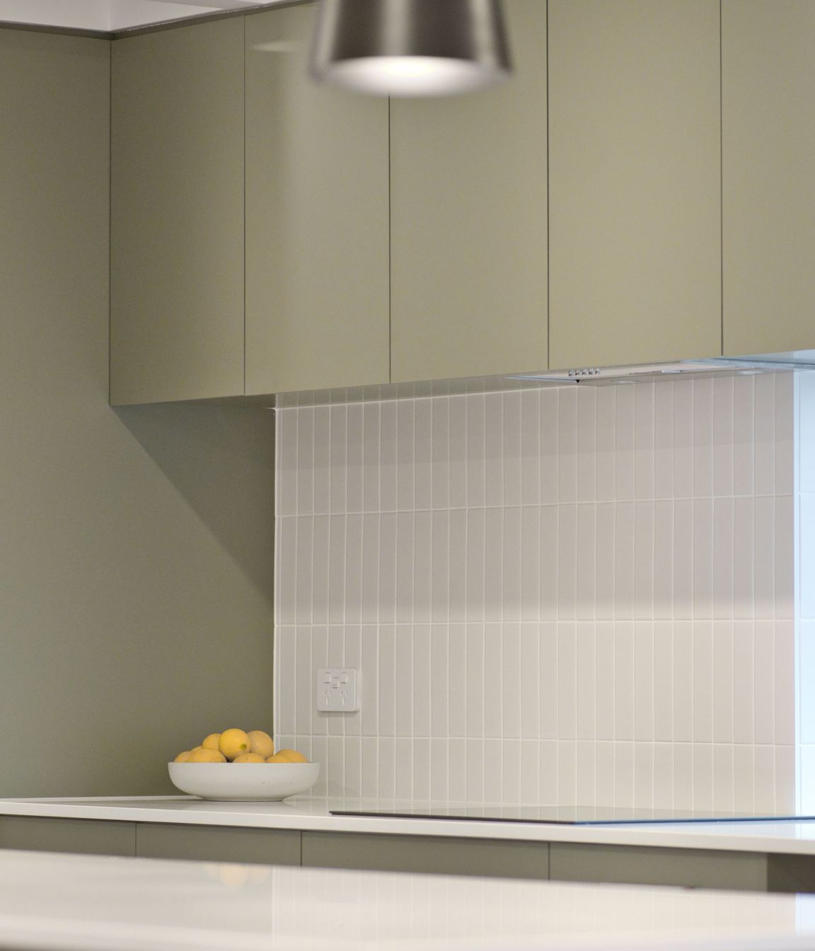 "Many of the other projects we’ve completed recently have had Hamptons-style kitchens with white shaker profile cupboards and drawers, but these homeowners have done something a little bit different which is great to see."