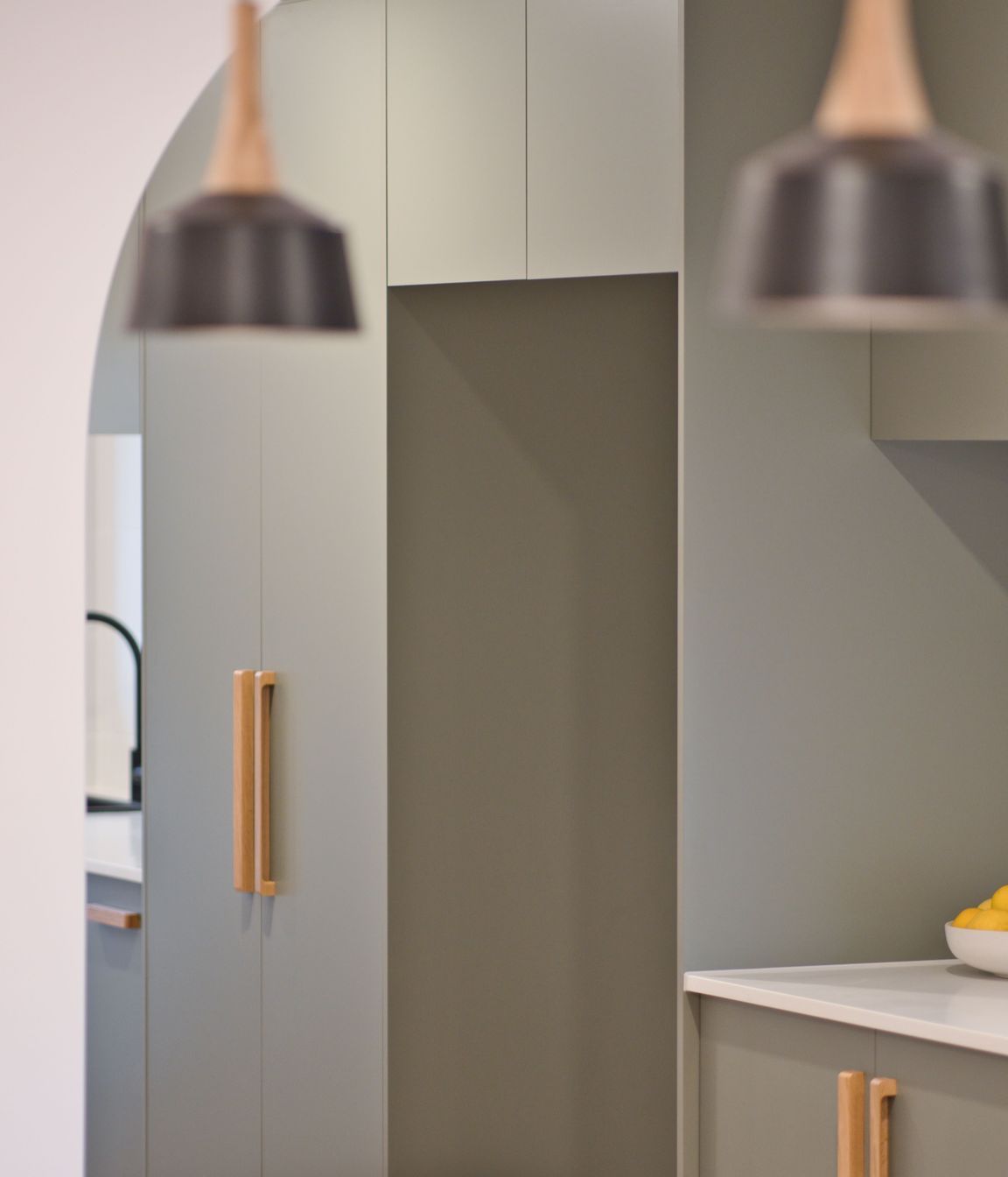 "Everyone wants that coastal feel, and they’ve done this in a modern way with flat kitchen cupboard panels and sage green which makes a big impact."