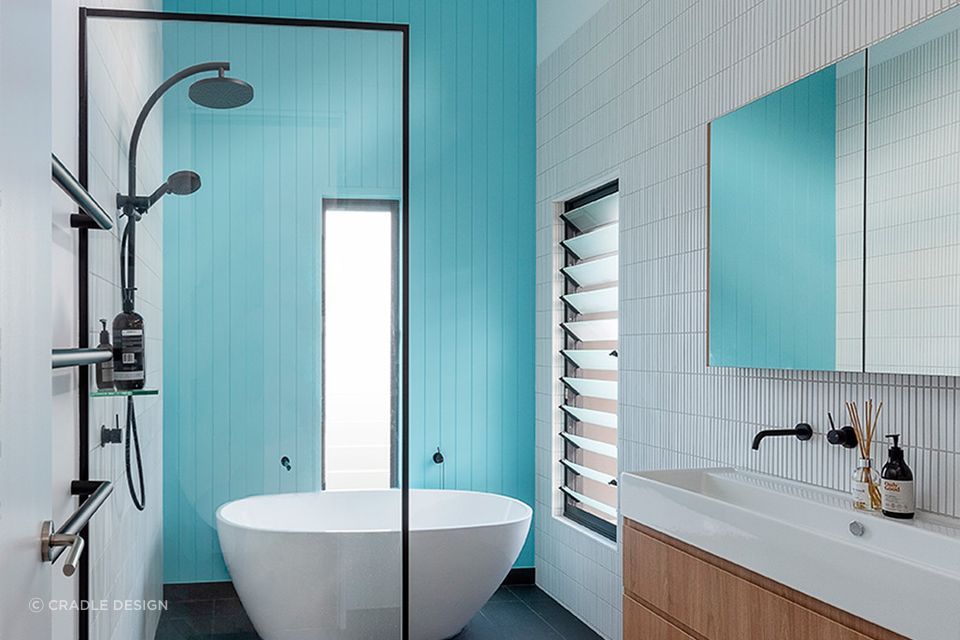 Beautiful blue wall bathroom with freestanding bathtub | Photographer: Stefanie Zingsheim