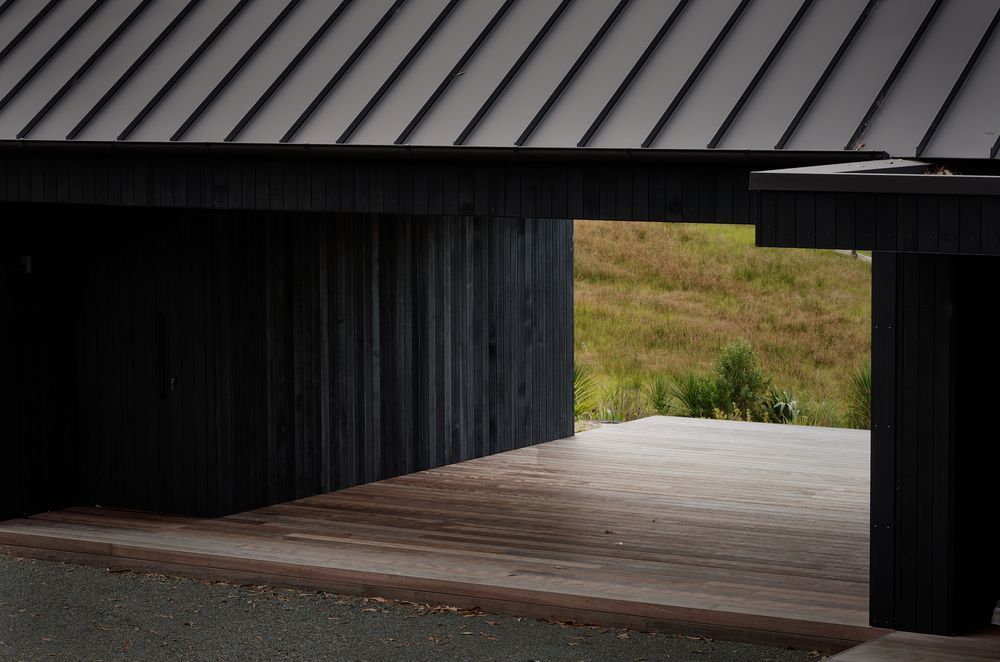 Almost the entire exterior is clad in striking black quarter sawn vertical cedar timber.