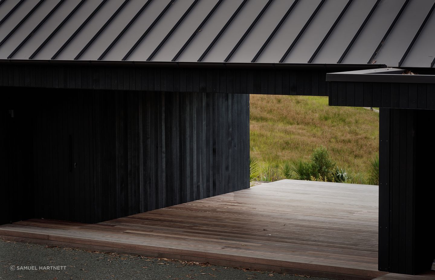 Almost the entire exterior is clad in striking black quarter sawn vertical cedar timber.