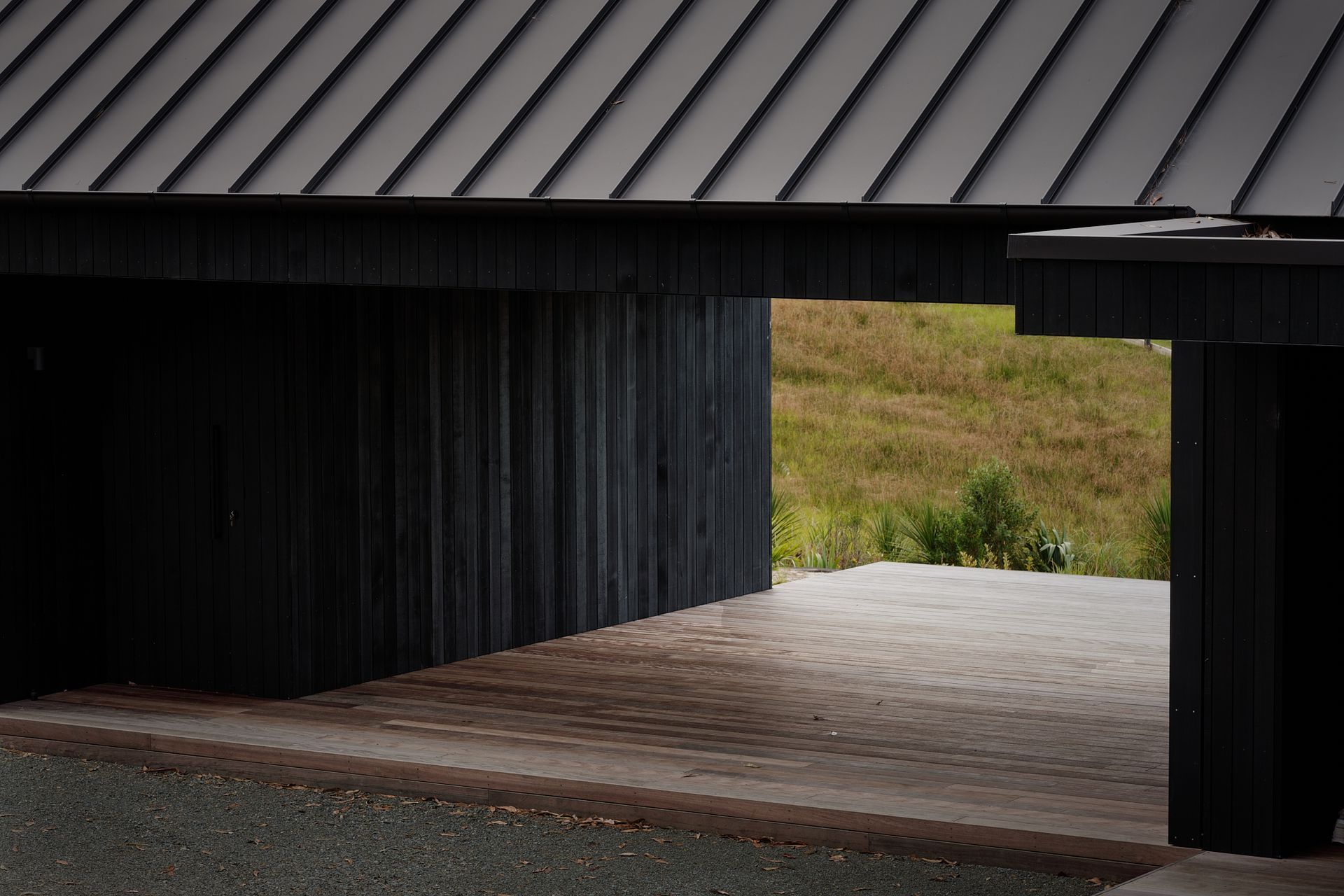 Almost the entire exterior is clad in striking black quarter sawn vertical cedar timber.