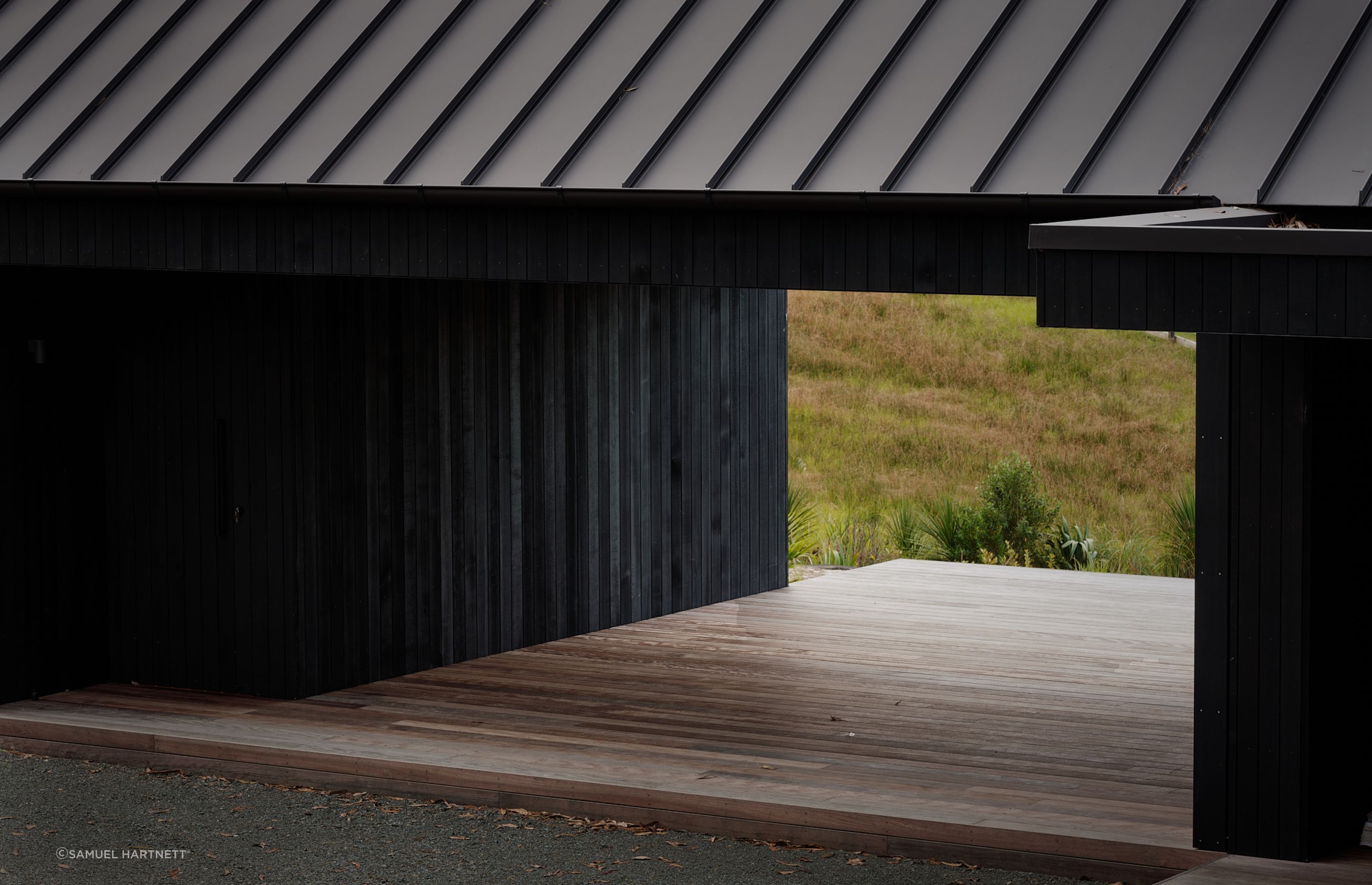 Almost the entire exterior is clad in striking black quarter sawn vertical cedar timber.