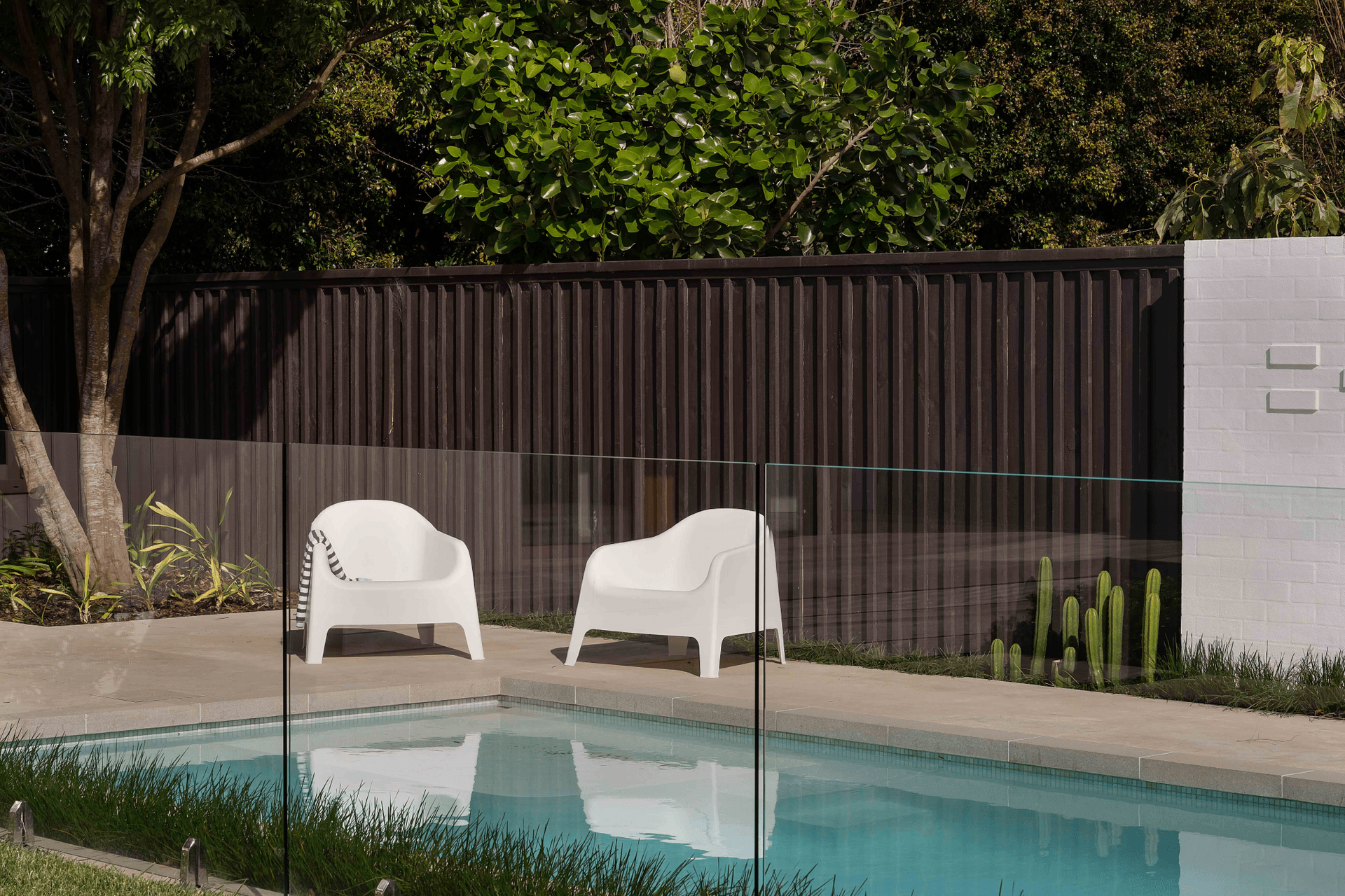 The new pool area and pool house gives the home a resort-like vibe.