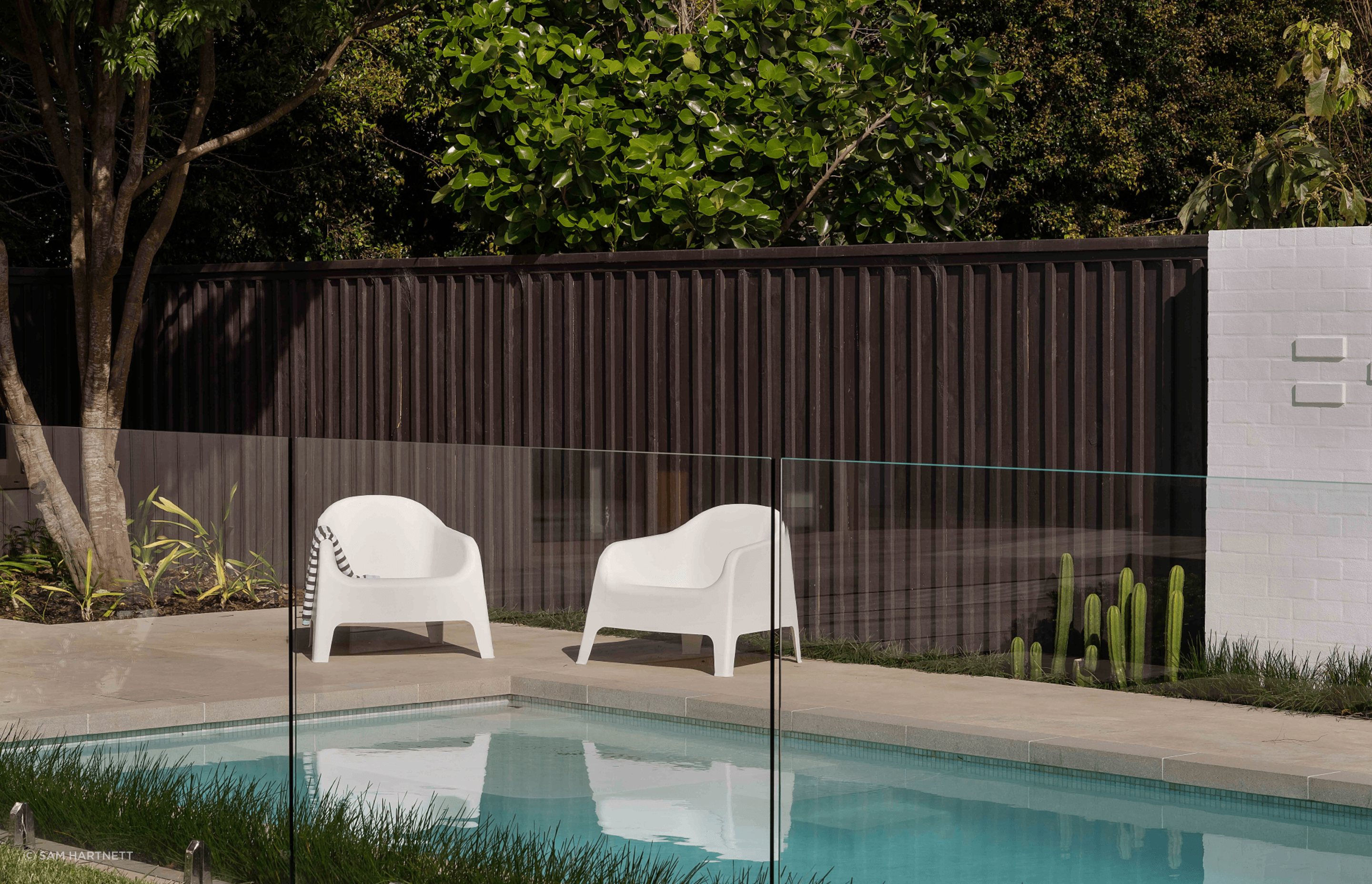 The new pool area and pool house gives the home a resort-like vibe.
