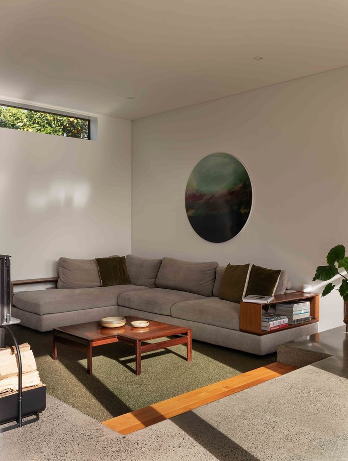 The conversation pit is formed into the concrete foundation.