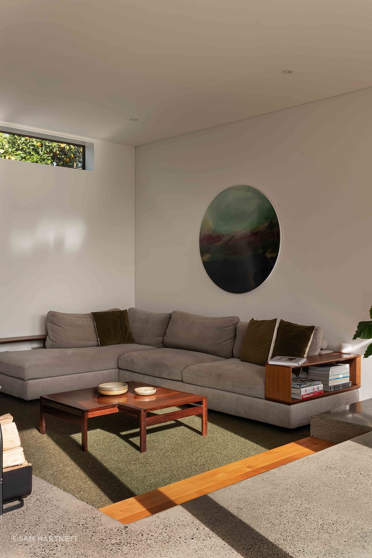 The conversation pit is formed into the concrete foundation.