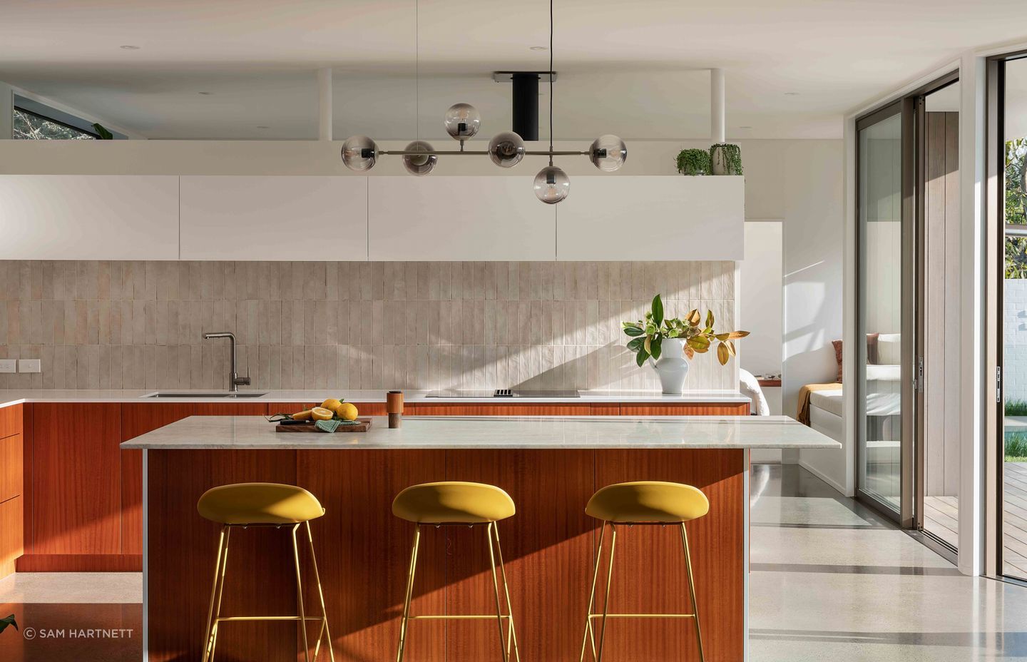 The kitchen was designed with a strong mid-century aesthetic.