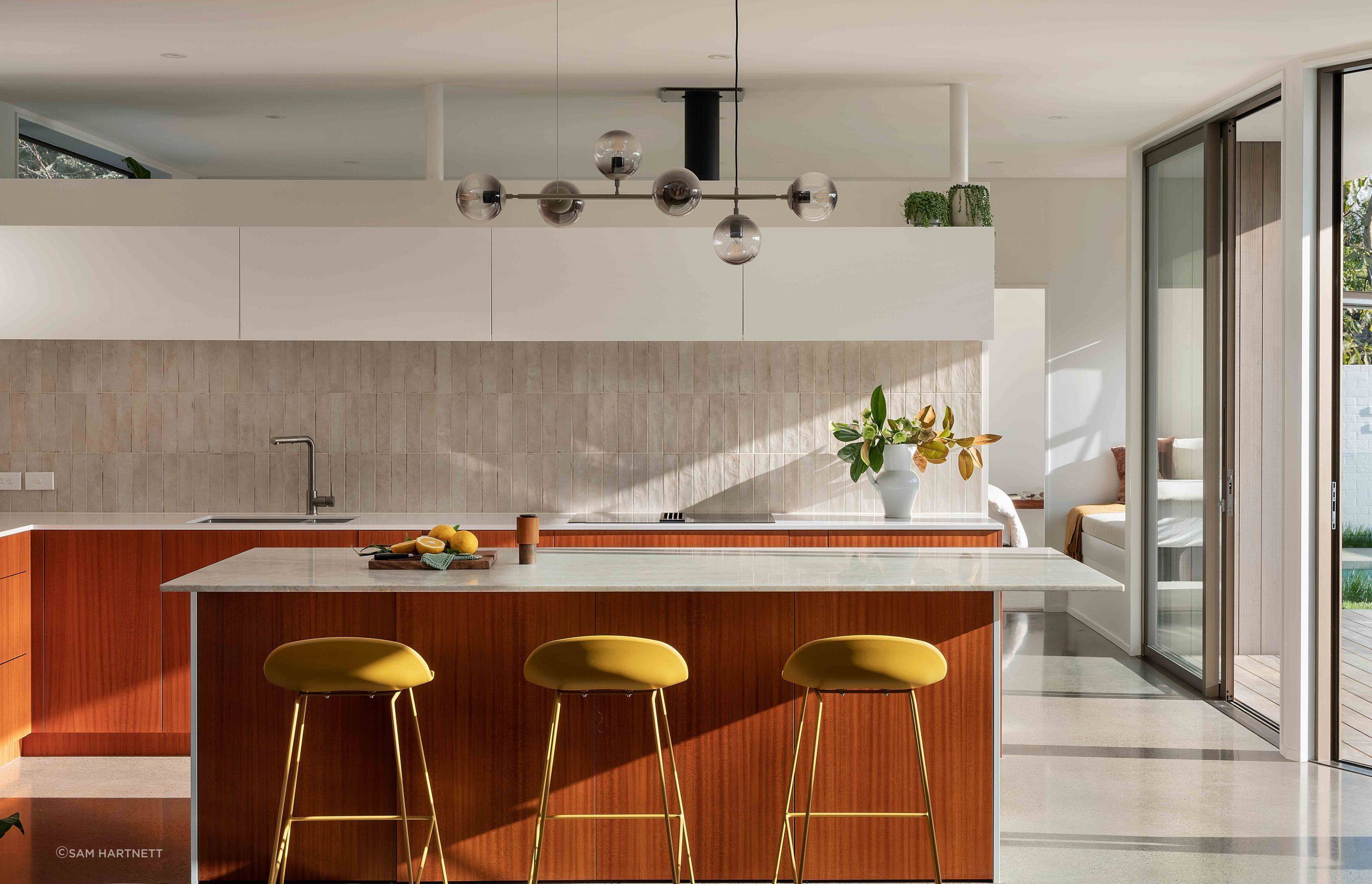 The kitchen was designed with a strong mid-century aesthetic.