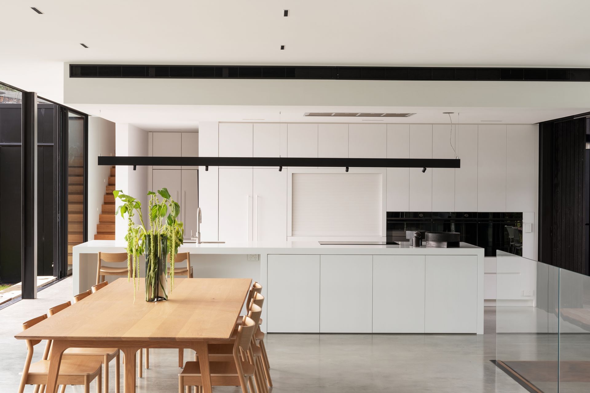 Daniel designed the kitchen to suit the client’s low-key approach. Most appliances are Fisher &amp; Paykel. The Swiss kitchen mixer is from Plumbline, and the benchtops are Corian.