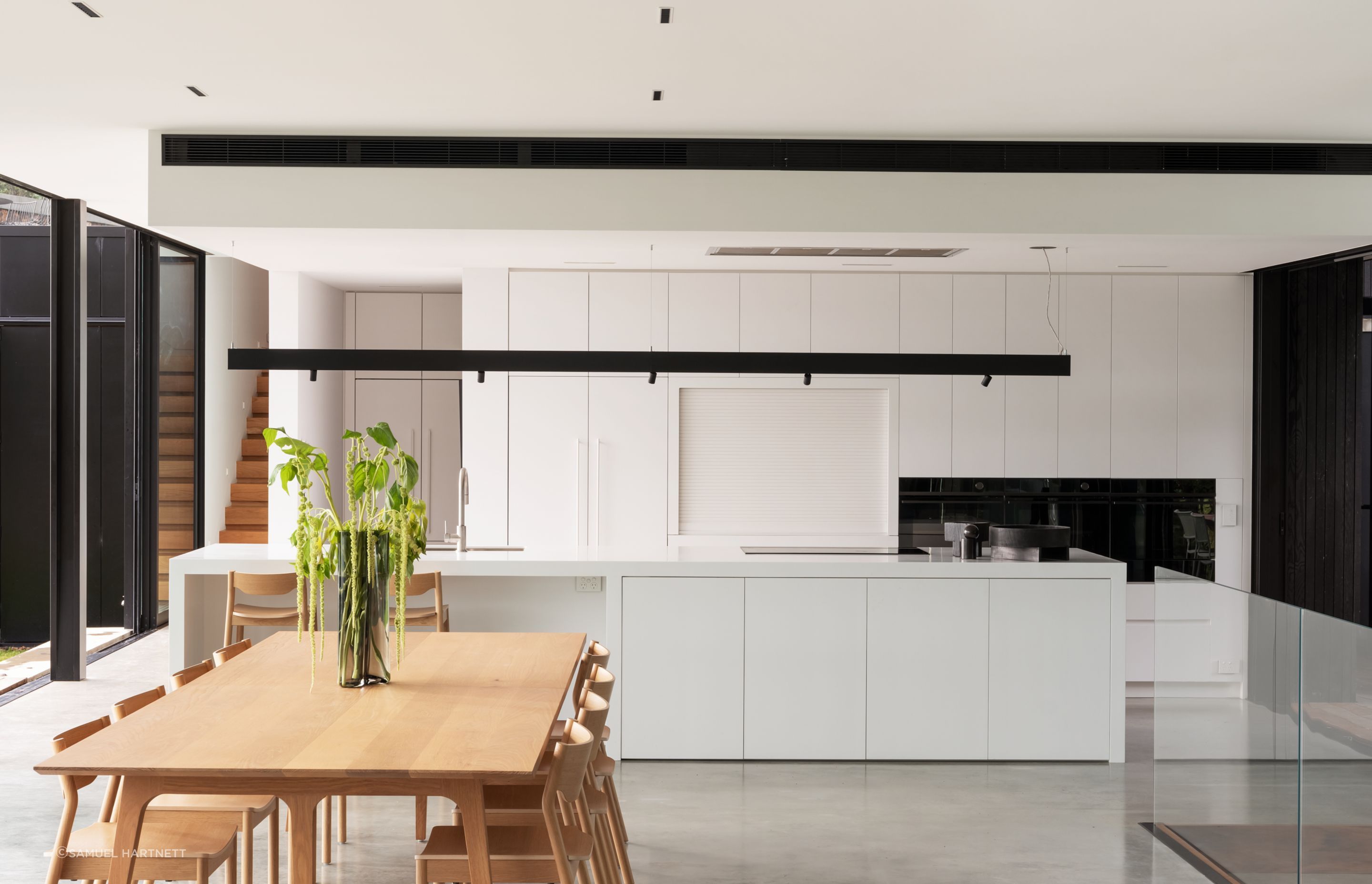 Daniel designed the kitchen to suit the client’s low-key approach. Most appliances are Fisher & Paykel. The Swiss kitchen mixer is from Plumbline, and the benchtops are Corian.