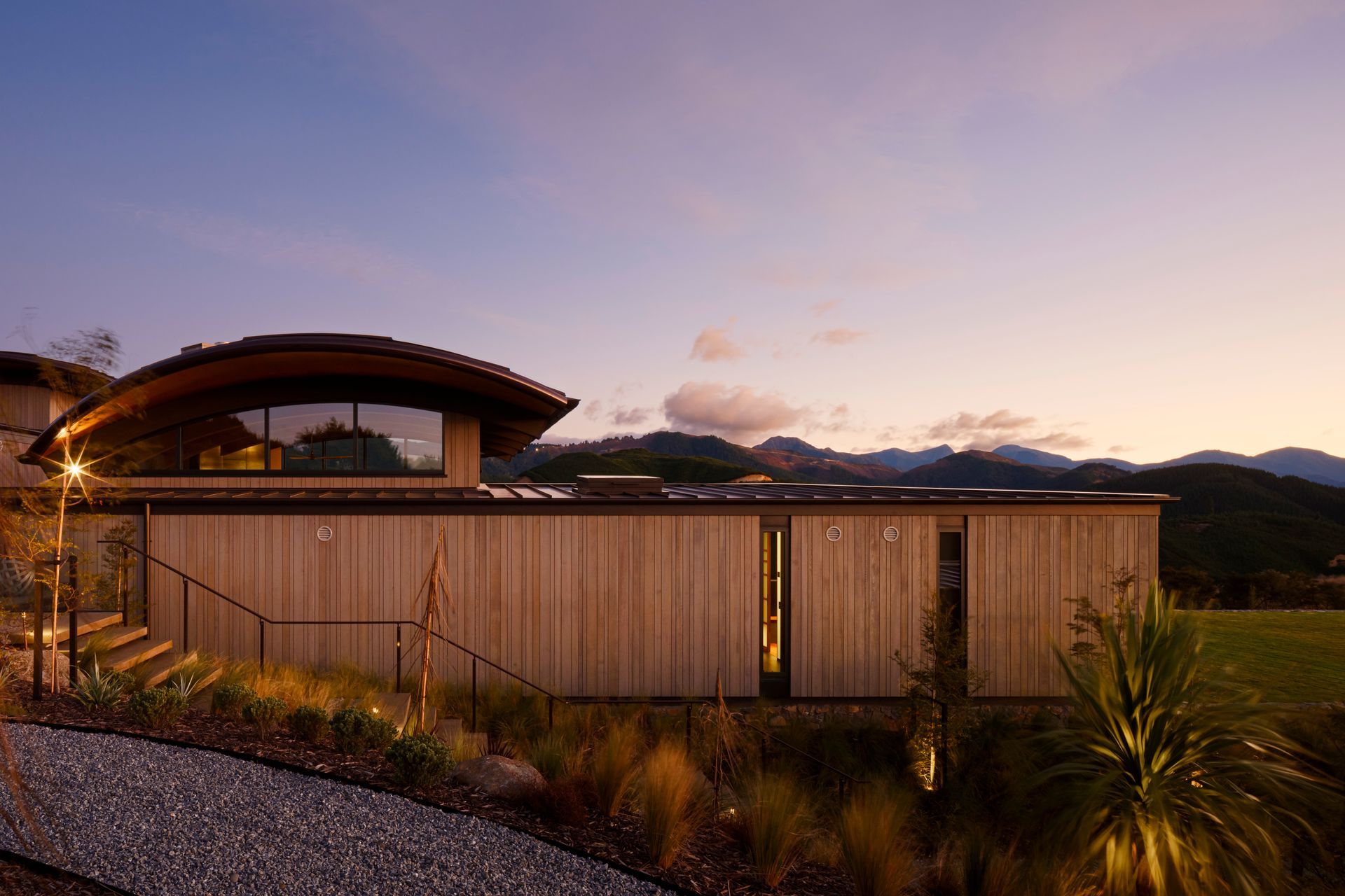 The vertical cedar shiplap is by Rosenfeld Kidson. The owners undertook an extensive amount of native planting.