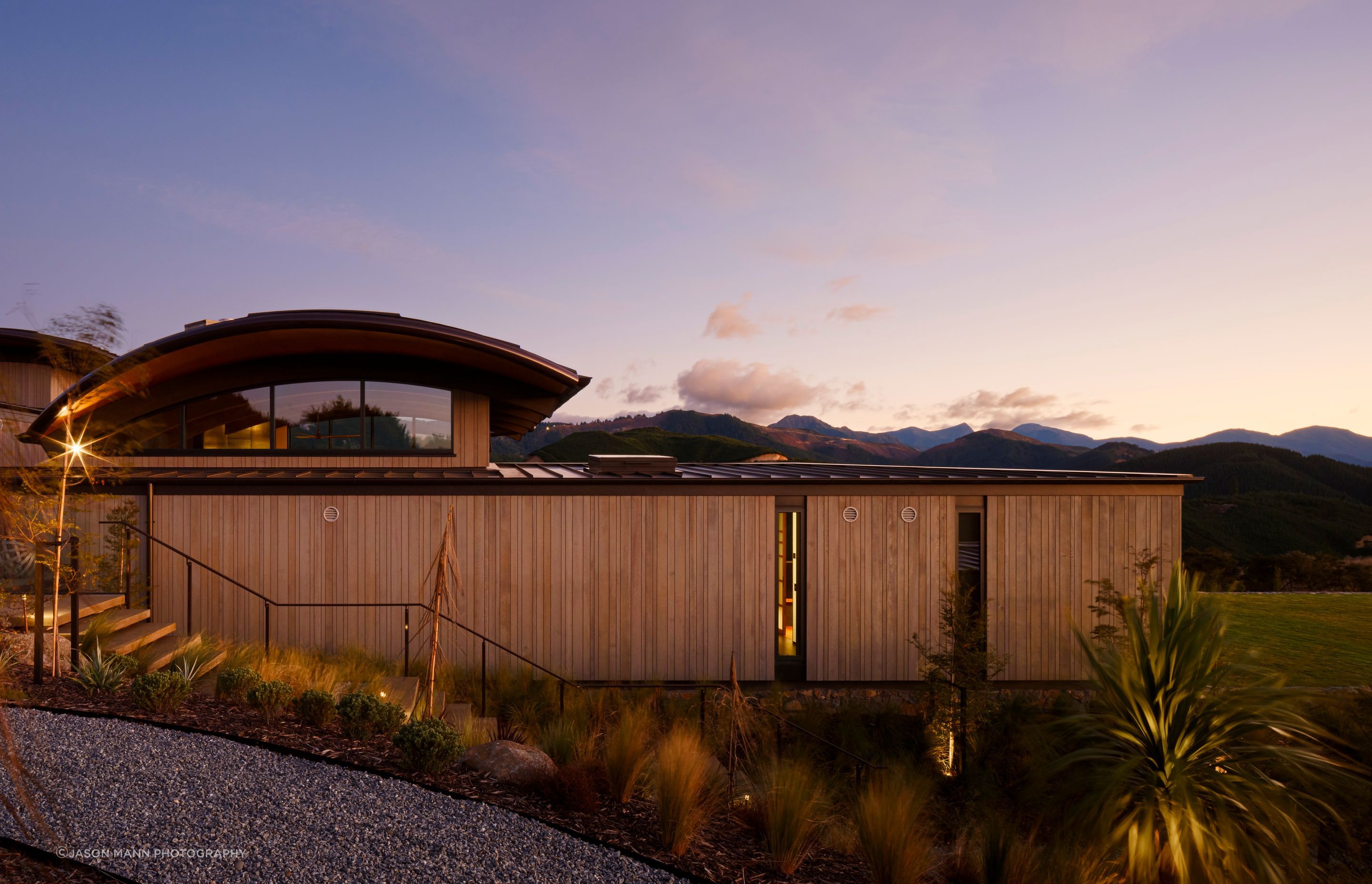 The vertical cedar shiplap is by Rosenfeld Kidson. The owners undertook an extensive amount of native planting.