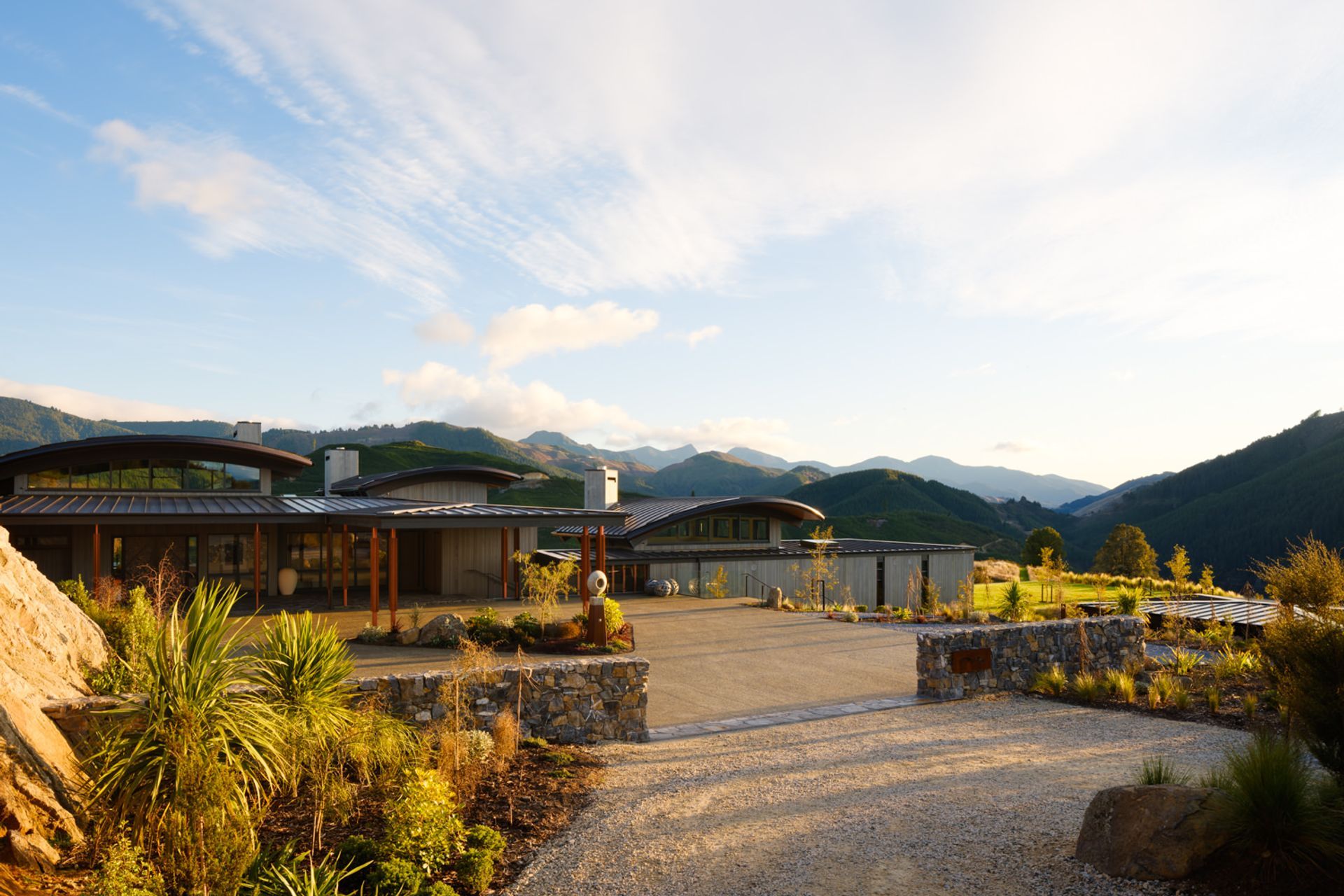 The entrance by road allows a slow reveal of the building. Simon says the entire complex is all off-grid. “It has quite a reasonable solar farm setting up the back, on the hill. It has its own generator, water and wastewater.”