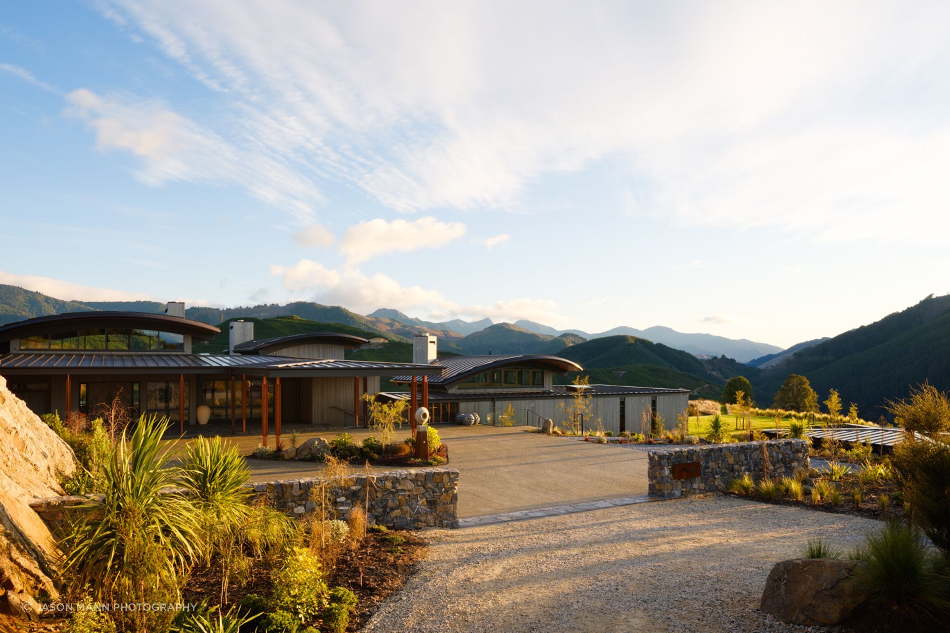 The entrance by road allows a slow reveal of the building. Simon says the entire complex is all off-grid. “It has quite a reasonable solar farm setting up the back, on the hill. It has its own generator, water and wastewater.”