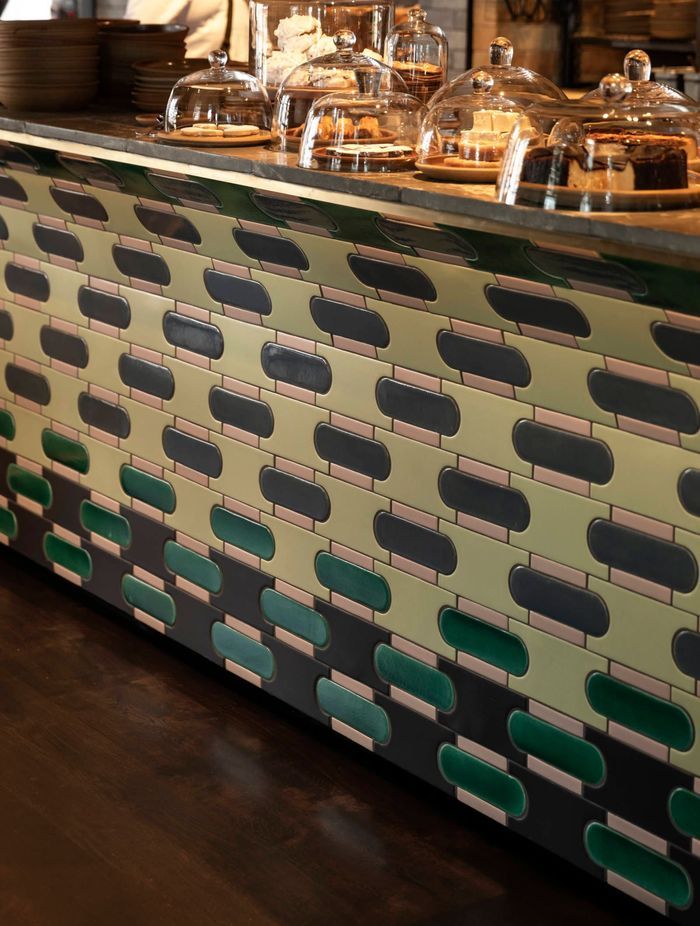 Colourful handmade tiles were chosen for the base of the bar counter and laid to accommodate a seamless pattern.