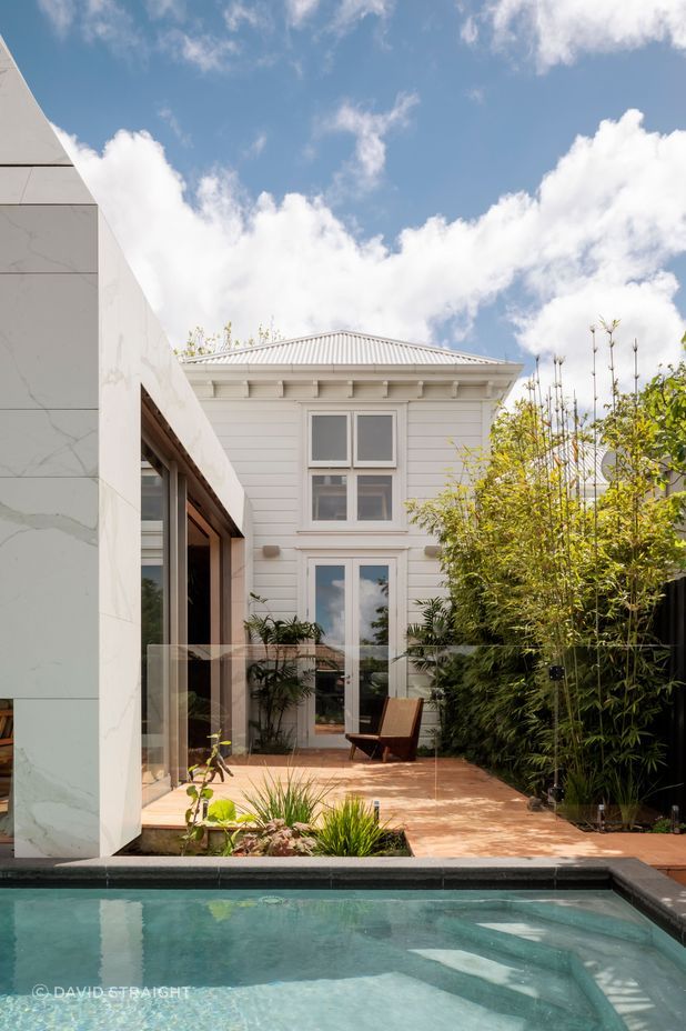 The villa extension by Jack McKinney of Jack McKinney Architects. The master suite upstairs is behind the tapered form. “We didn't want them to be looking into a bit of corrugated iron or an internal gutter.” It also screens them from neighbours.