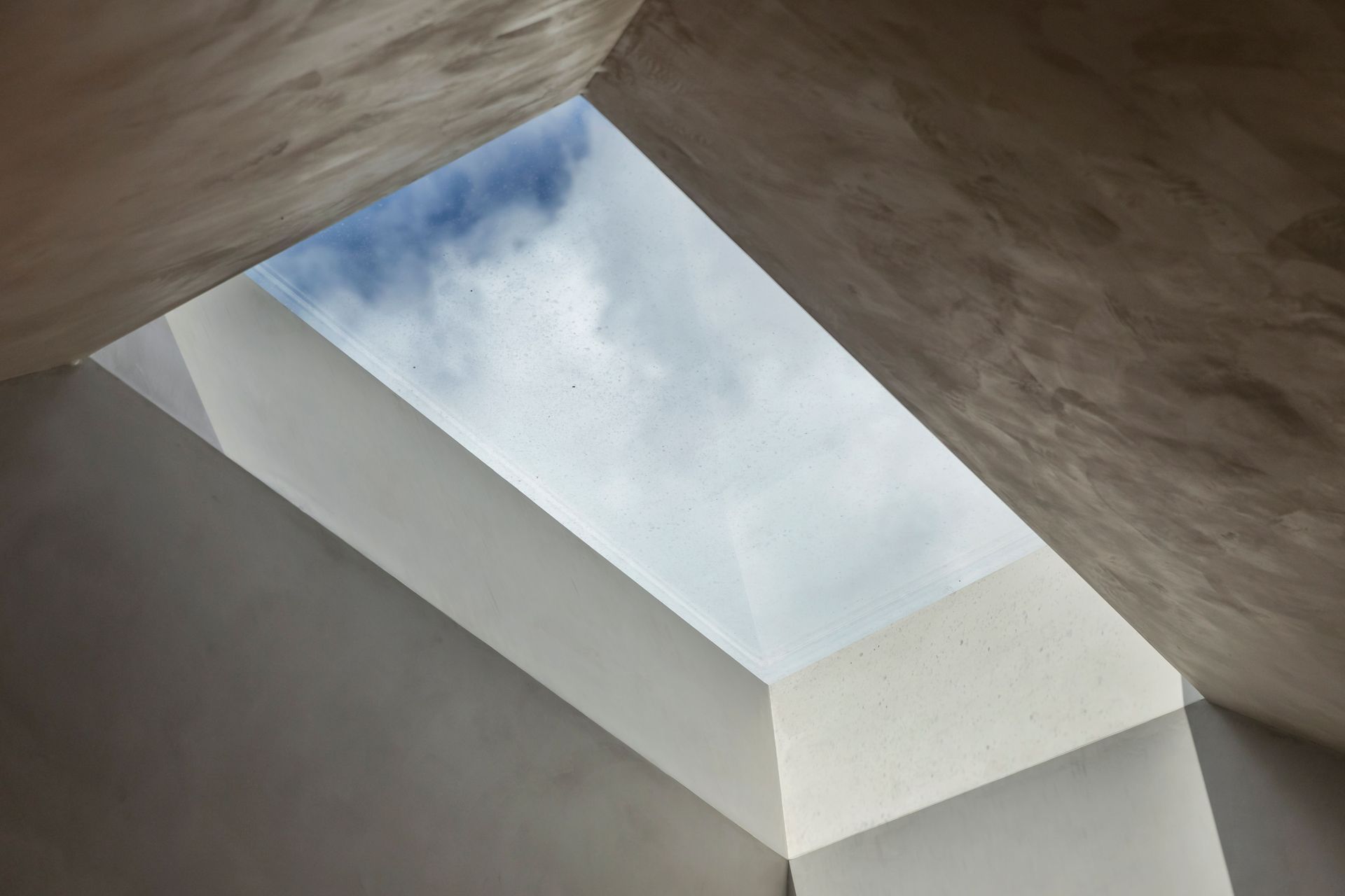 “The afternoon light is not on the garden side of the house,” says Jack. “So the skylight brings that right into the living room.”