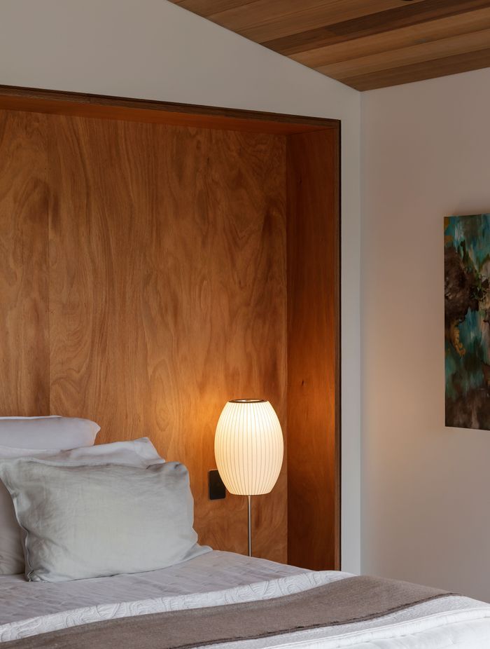 The elevated main bedroom catches wide views across the neighbourhood and Hobson Bay.