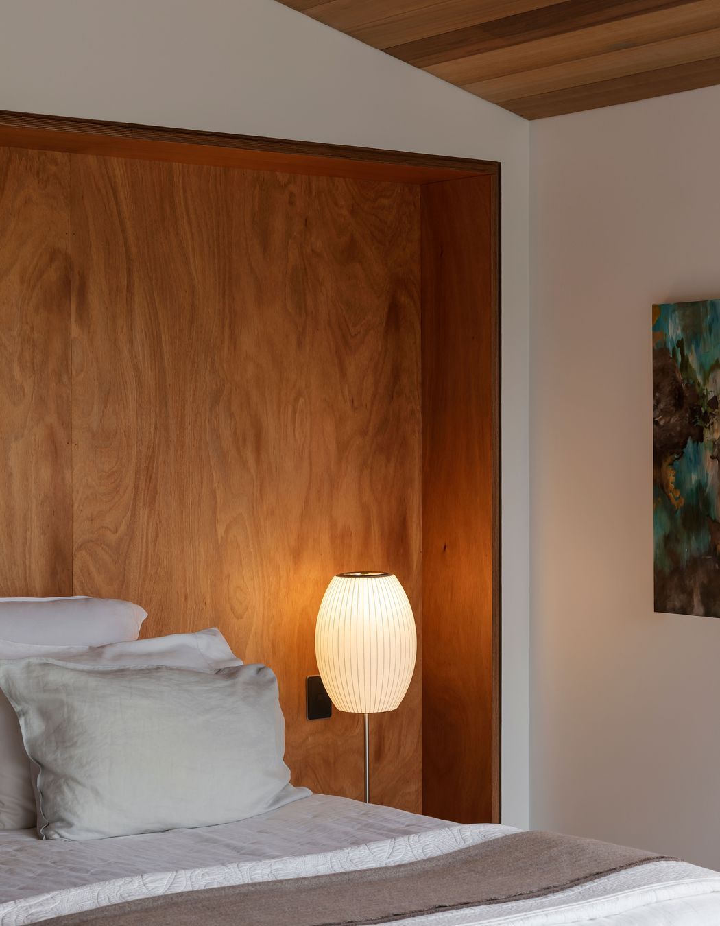 The elevated main bedroom catches wide views across the neighbourhood and Hobson Bay.