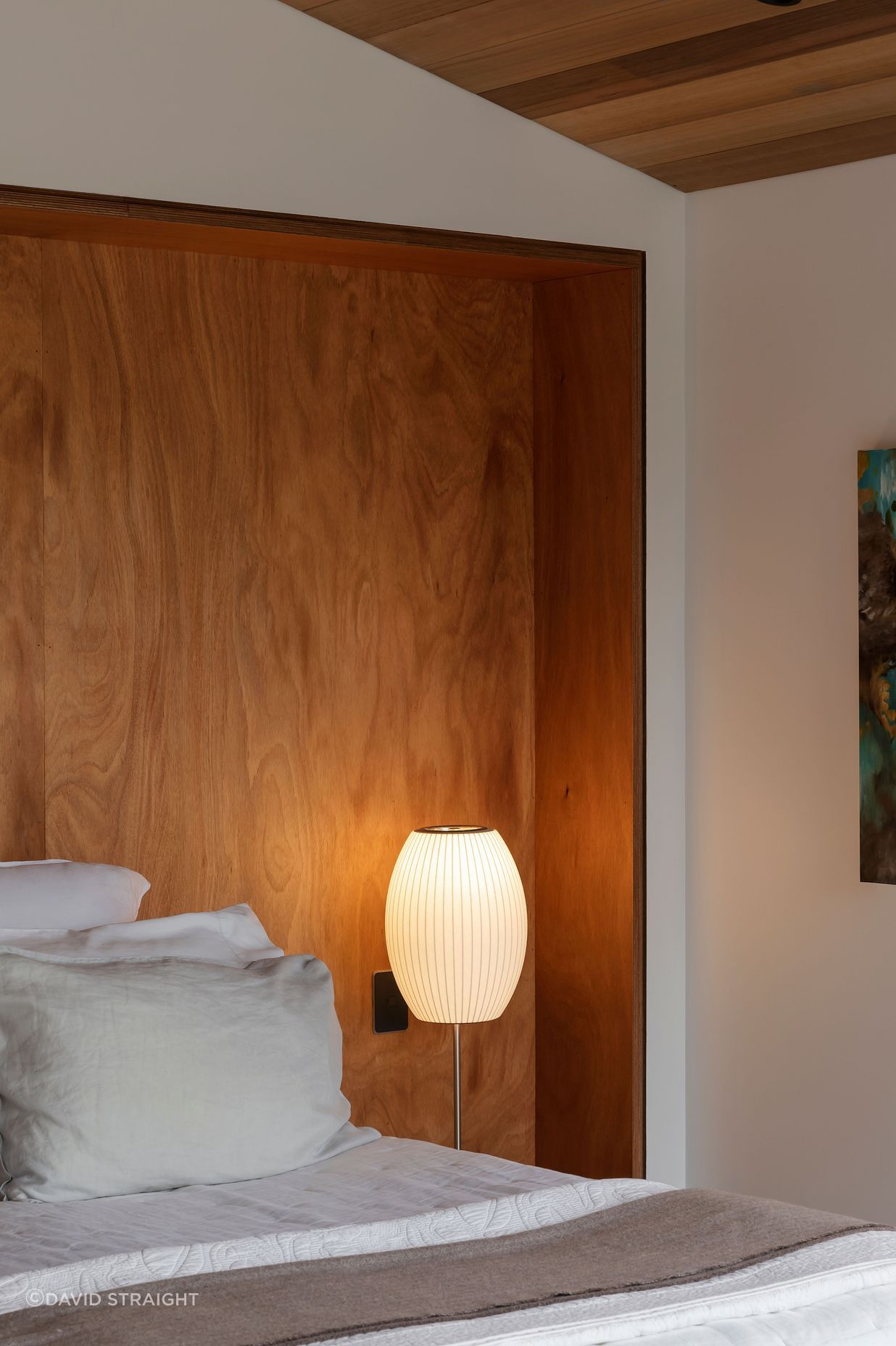 The elevated main bedroom catches wide views across the neighbourhood and Hobson Bay.