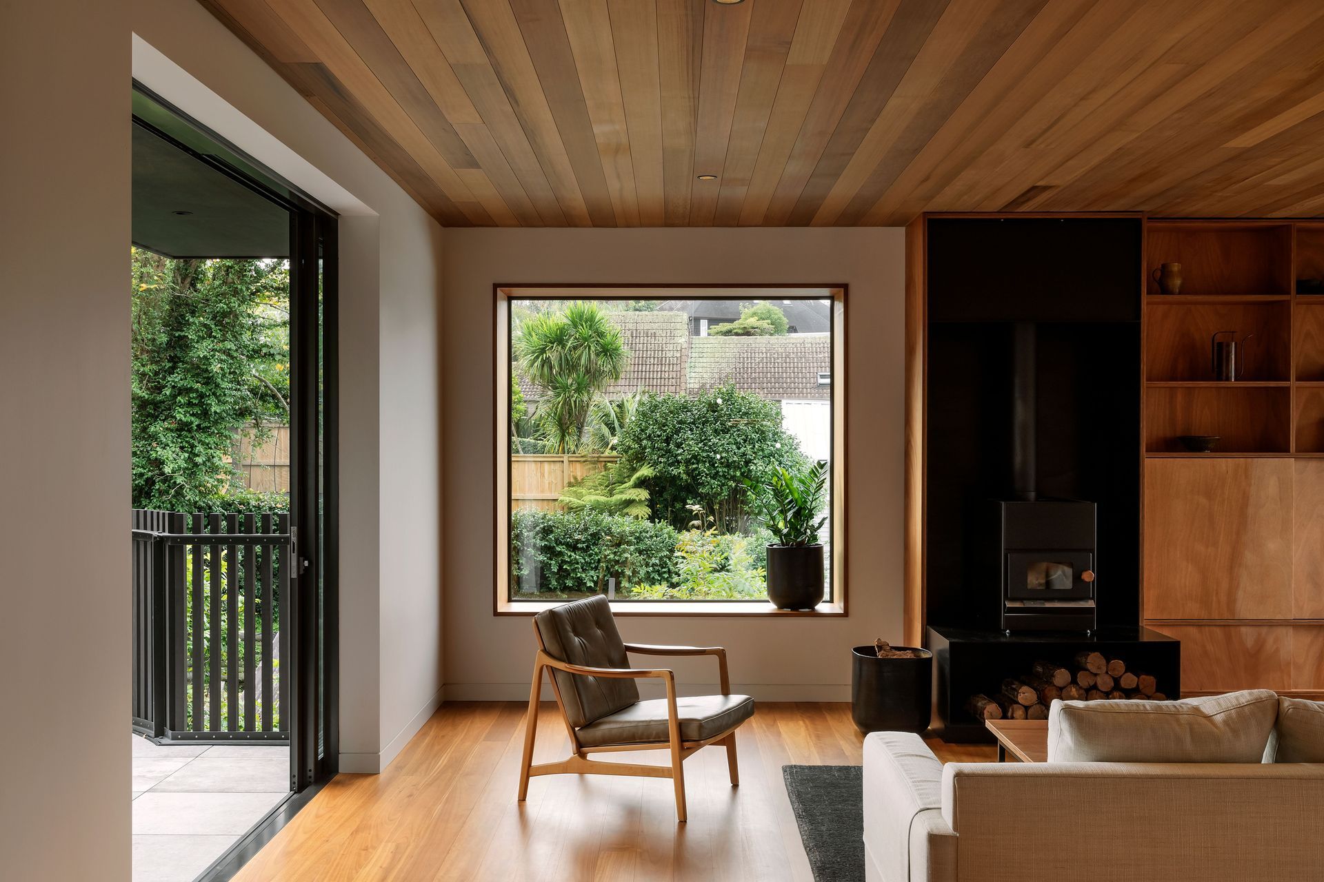 Gaboon ply is used throughout the house and ties everything to the living area. The Pyro Classic wood burner by Pyro Fires anchors the seating area.