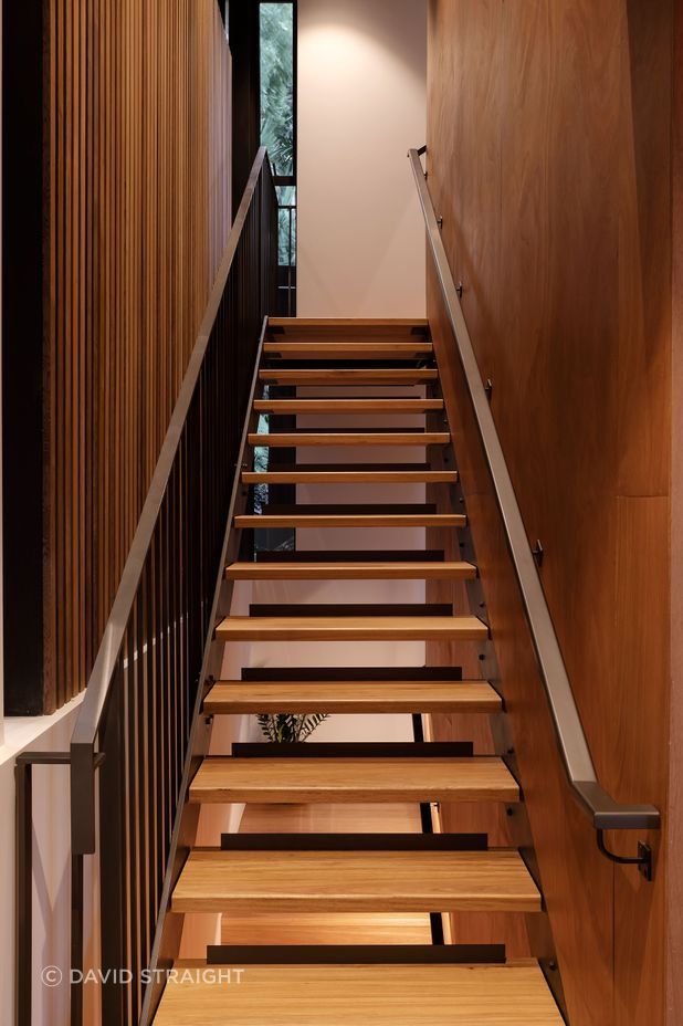 The open treads of the stairs to the main bedroom let light through. There is also a platform lift in the house: convenient now and for easier upstairs access if needed in the future.