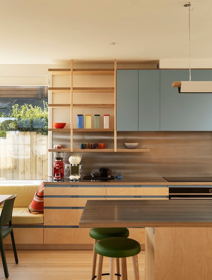 The interior palette features Victorian ash timber and birch ply cabinetry; soft, off-white walls; and pops of colours.