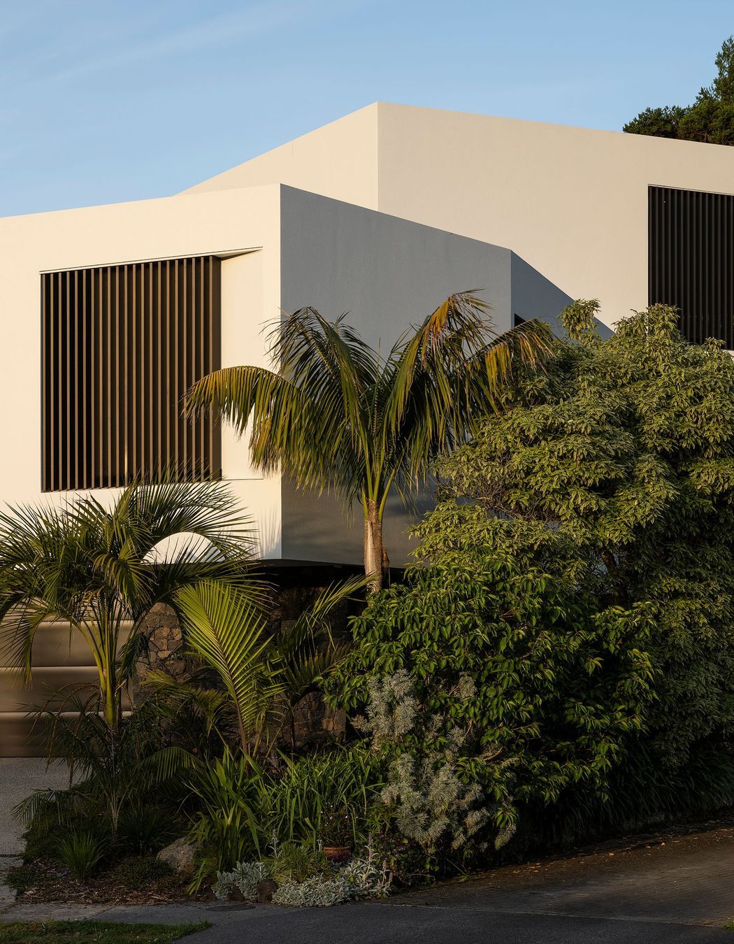 The sculptural street frontage belies the complexity and size of the home.