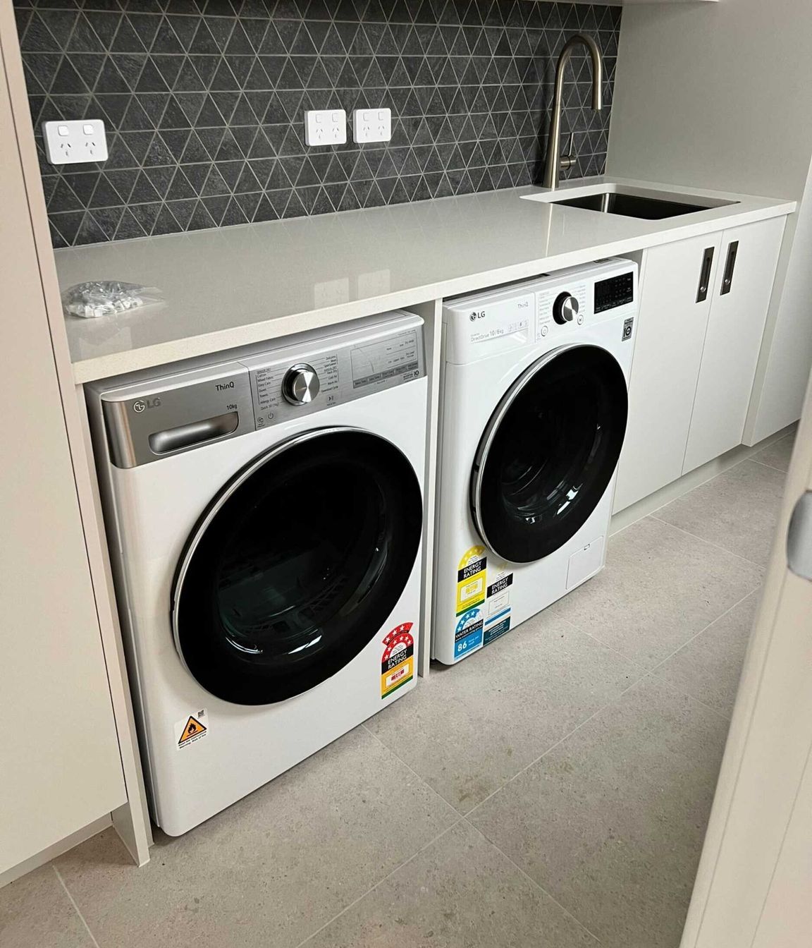BIM Projects Limited renovated the laundry with a new layout, flooring and cabinetry.