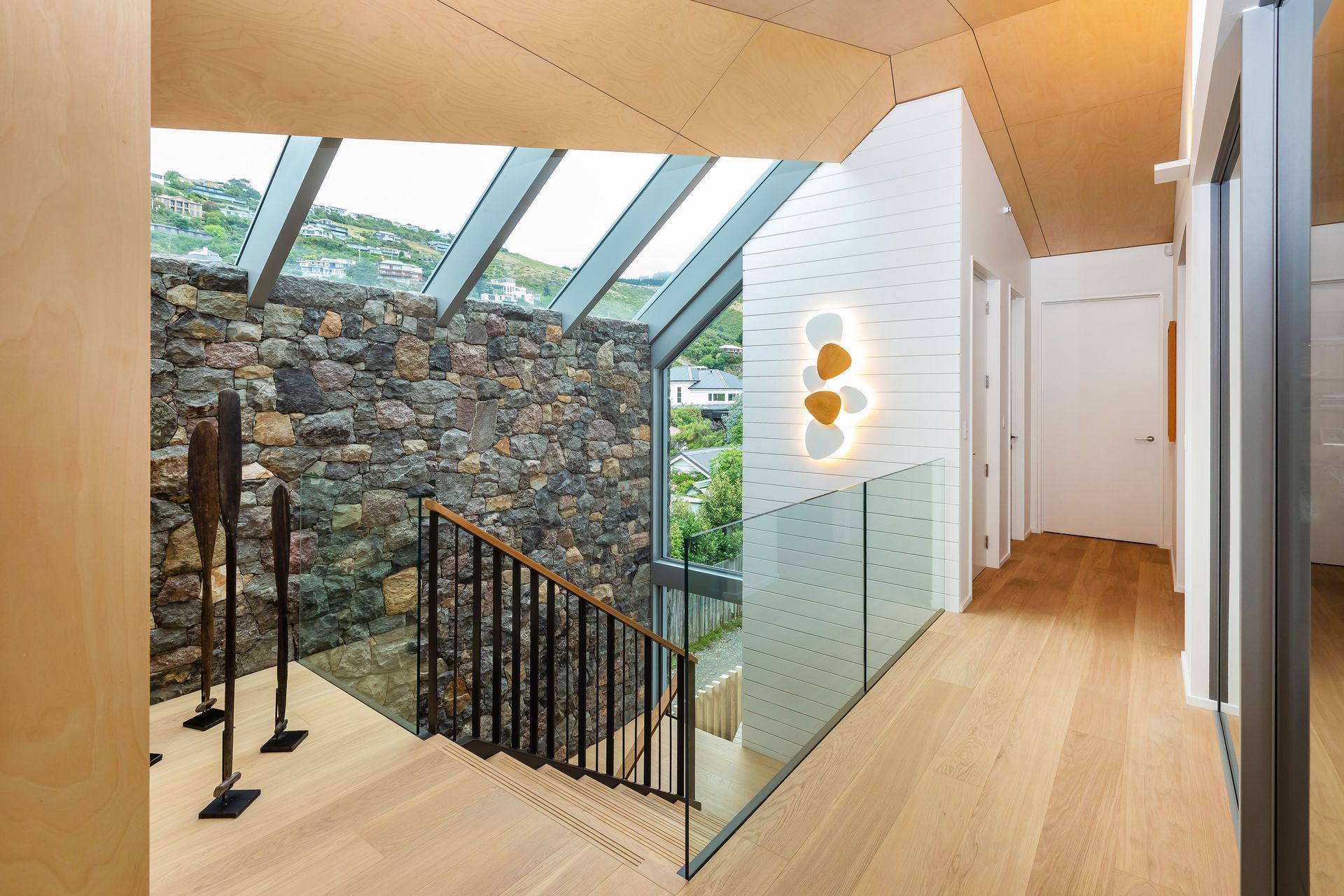 Driftwood Home's first level can be accessed from the ground floor via the staircase or lift. "With a lift to access the upper level, this has been created as a long-term home for our clients."