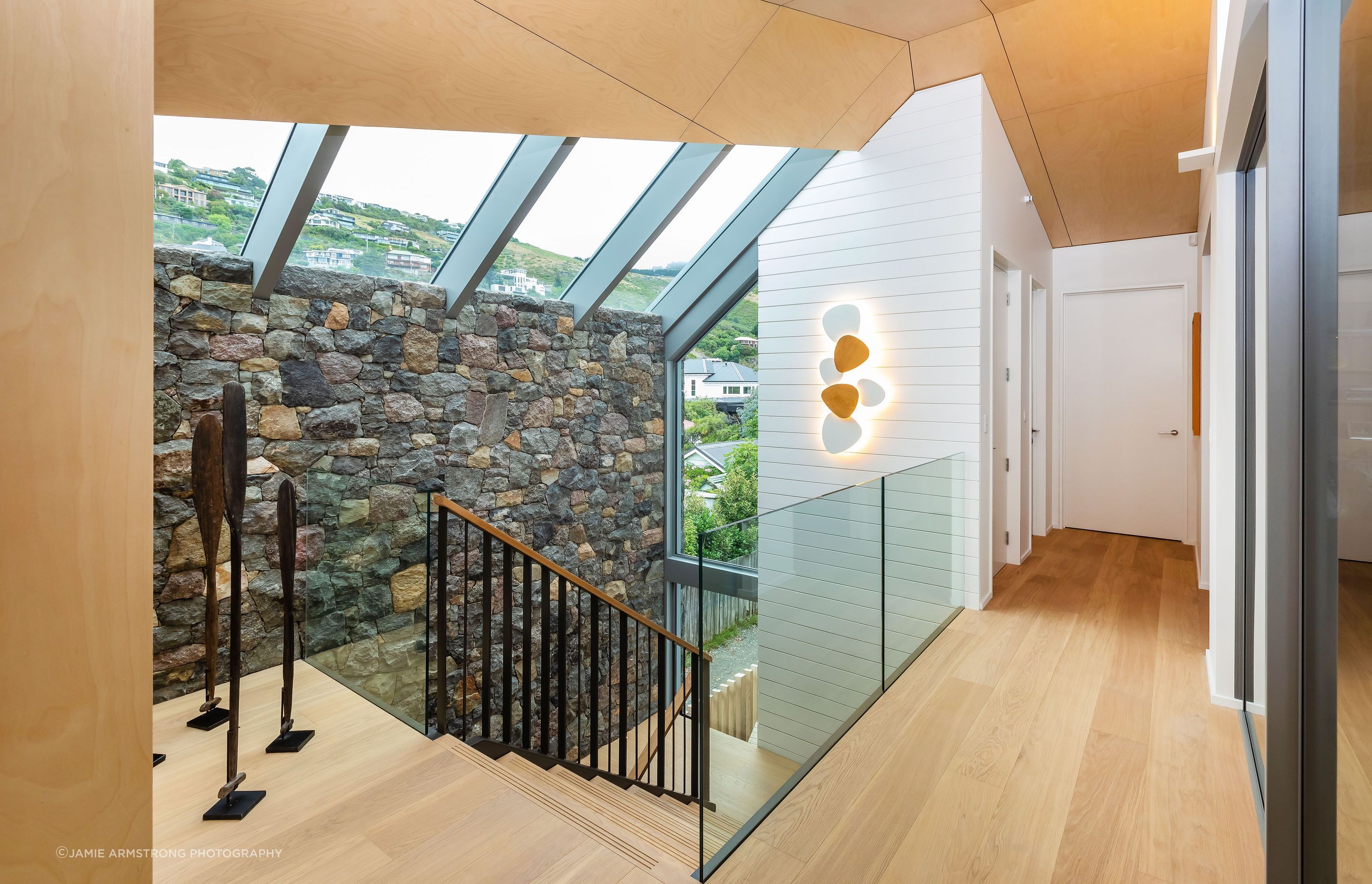 Driftwood Home's first level can be accessed from the ground floor via the staircase or lift. "With a lift to access the upper level, this has been created as a long-term home for our clients."