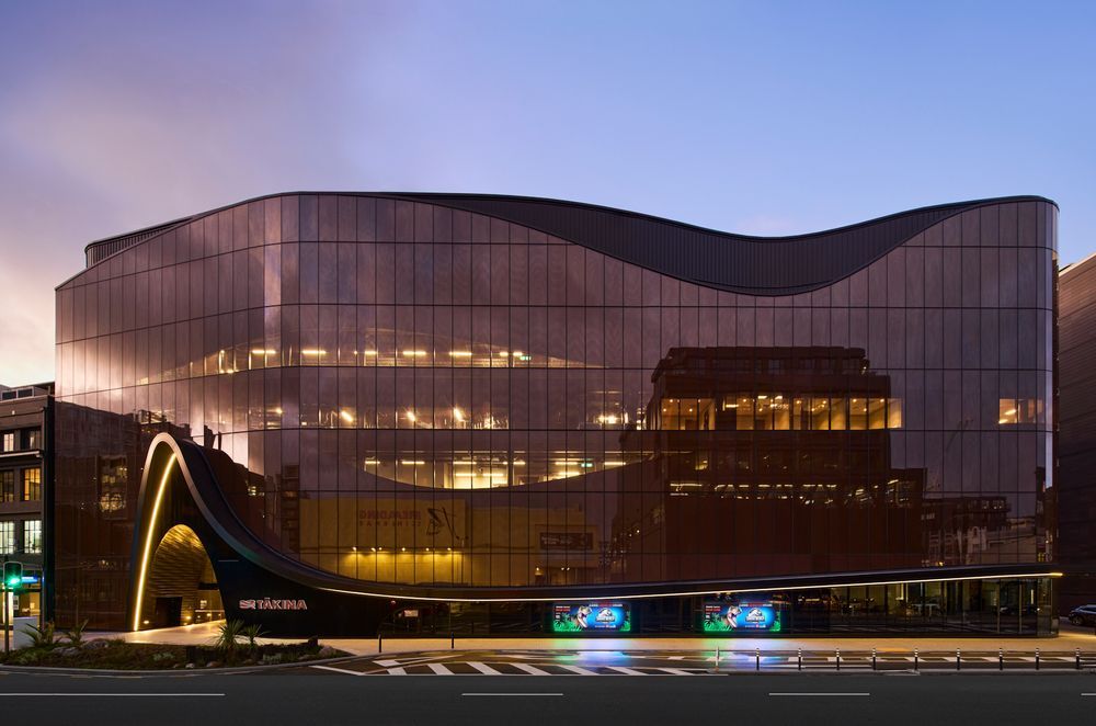 Tākina's Wakefield Street elevation, curving slightly outward into the convex of the street.