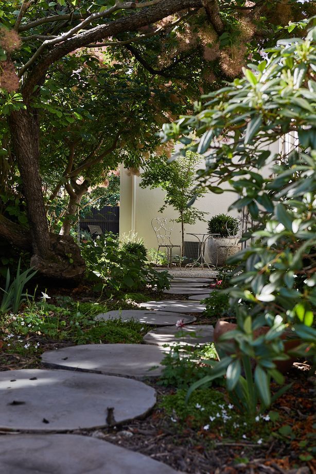 Multiple elements of the landscaping contribute to the Mediterranean feel.