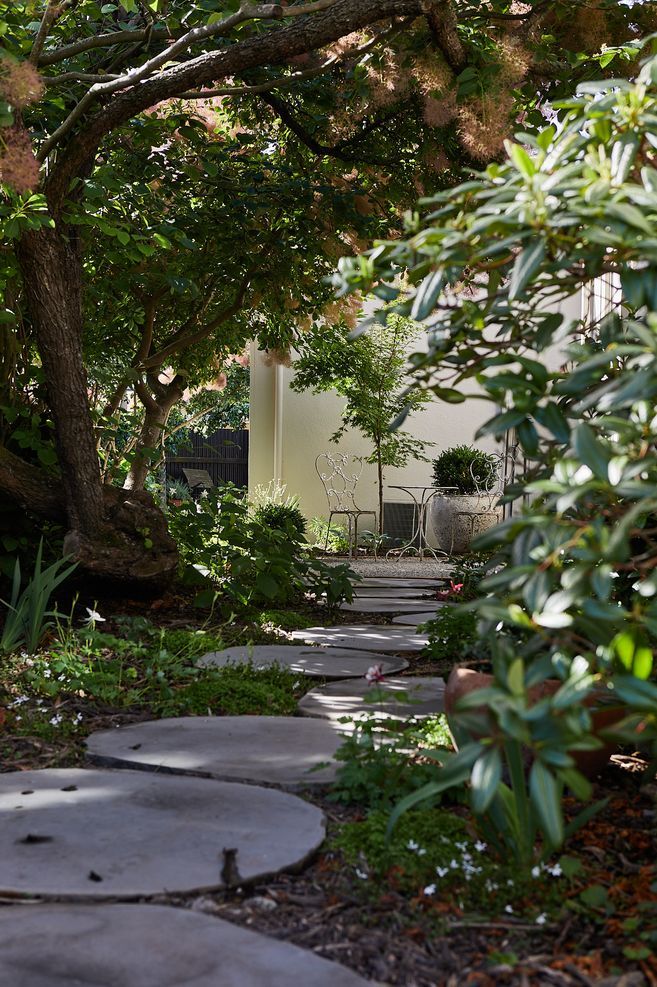 Multiple elements of the landscaping contribute to the Mediterranean feel.