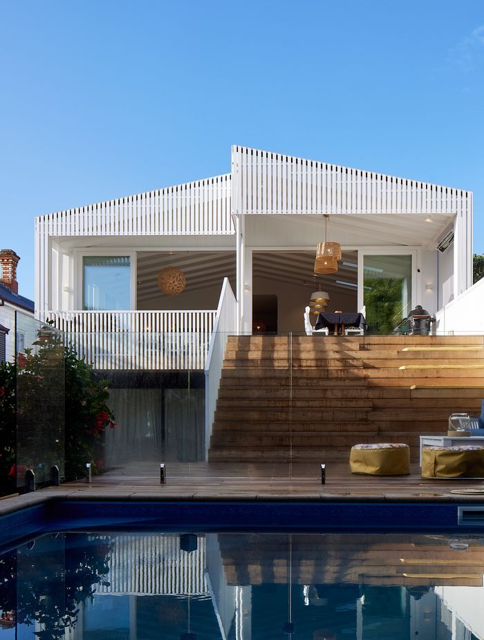 New grandstand style stairs double as seating for outdoor living. The basement level was developed in the 1990s and badly needed updating.
