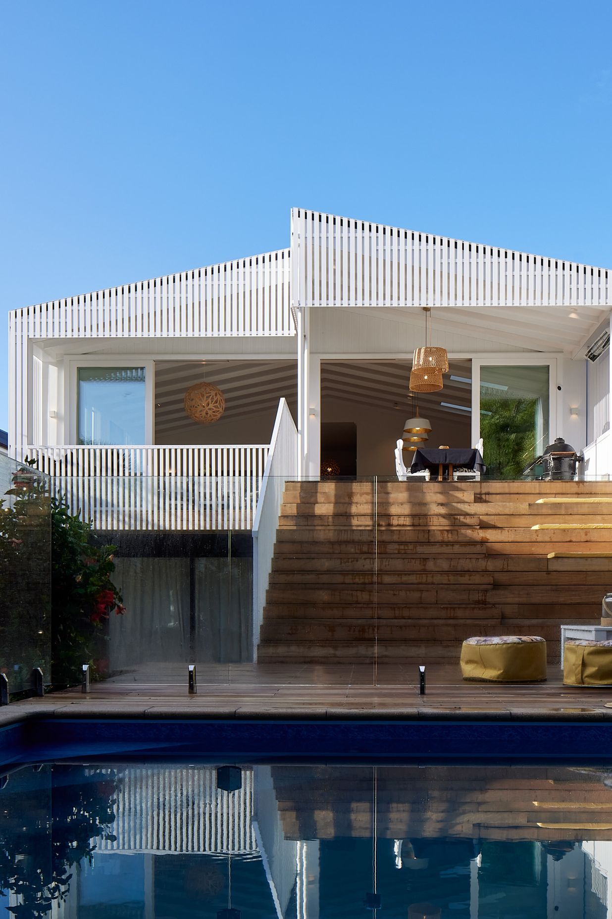 New grandstand style stairs double as seating for outdoor living. The basement level was developed in the 1990s and badly needed updating.