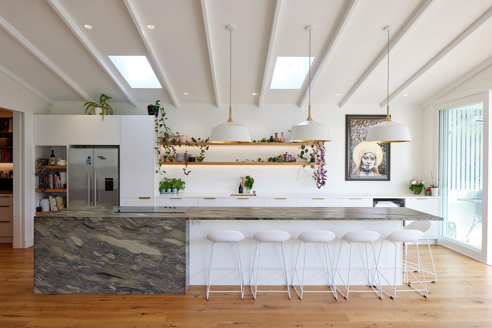 Daniel says Nigel and Cathie took the lead on the kitchen design because they had strong opinions, being restaurant owners. “They chose their own piece of stone — a Brazilian natural granite from Universal Granite. They really liked the leathered feel of it, the tactile nature. They’re big foodies.”