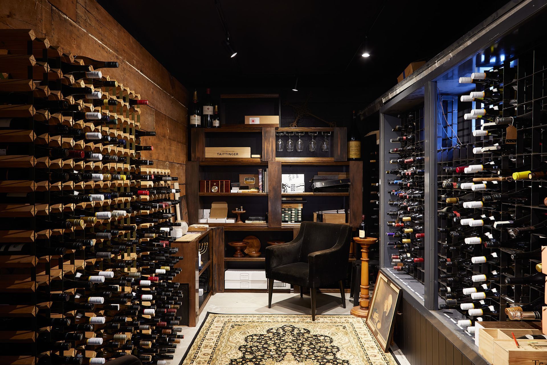 The wine cellar in the basement is a place of retreat designed in contrast to the bright, white upstairs.