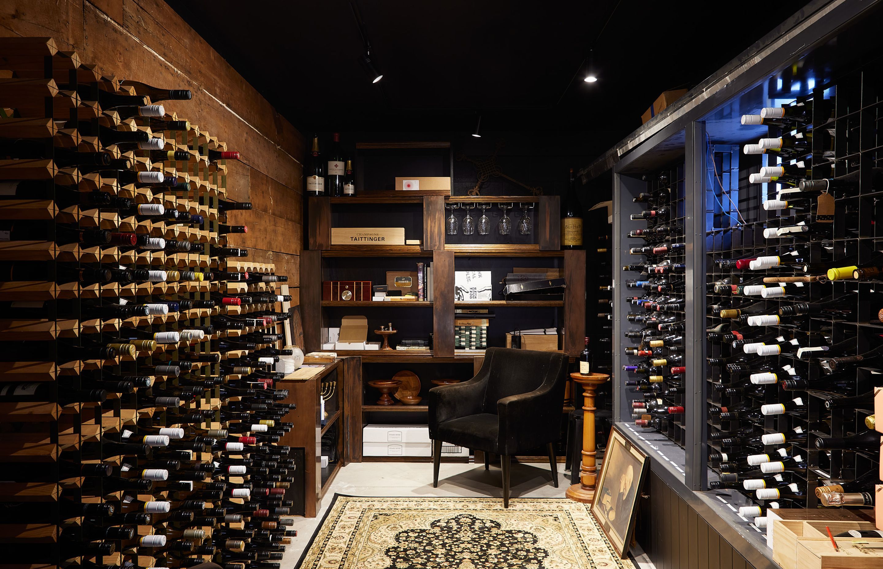 The wine cellar in the basement is a place of retreat designed in contrast to the bright, white upstairs.