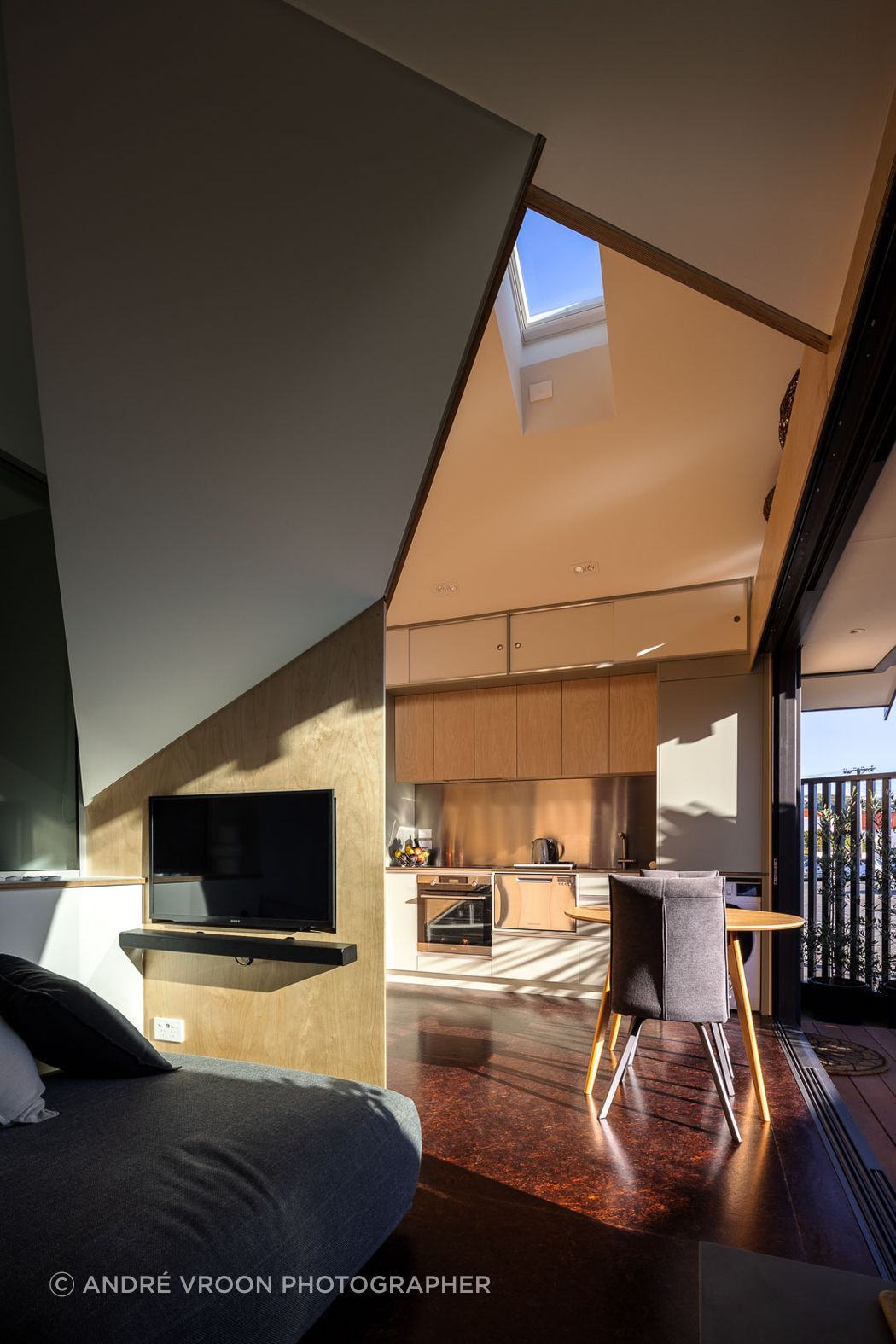 The ground floor living is cleverly designed in a triangular format to maximise space.