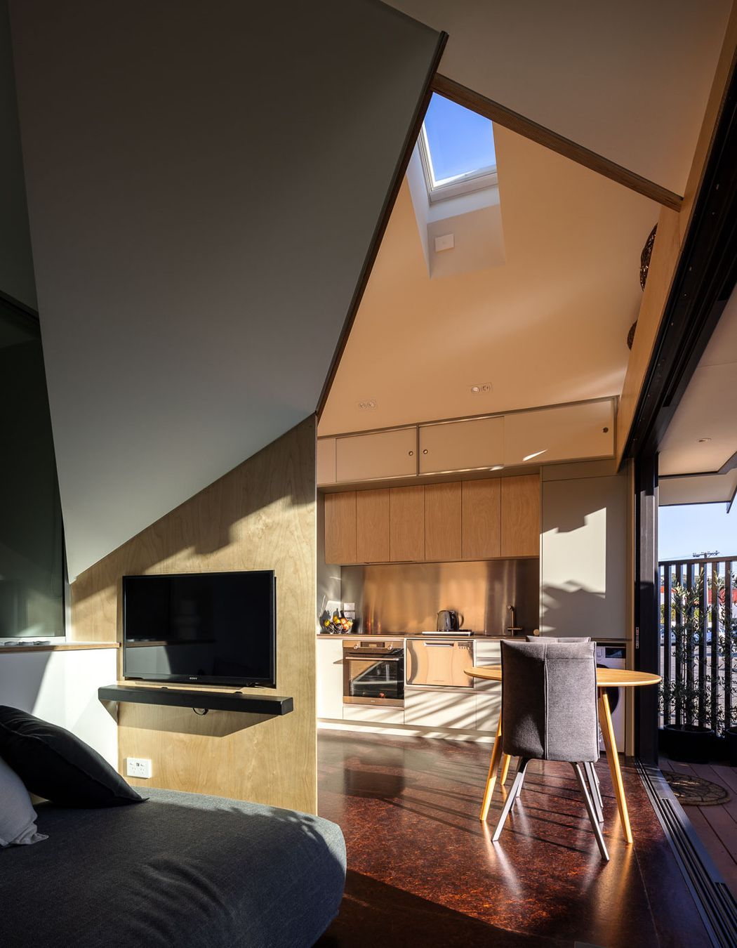 The ground floor living is cleverly designed in a triangular format to maximise space.