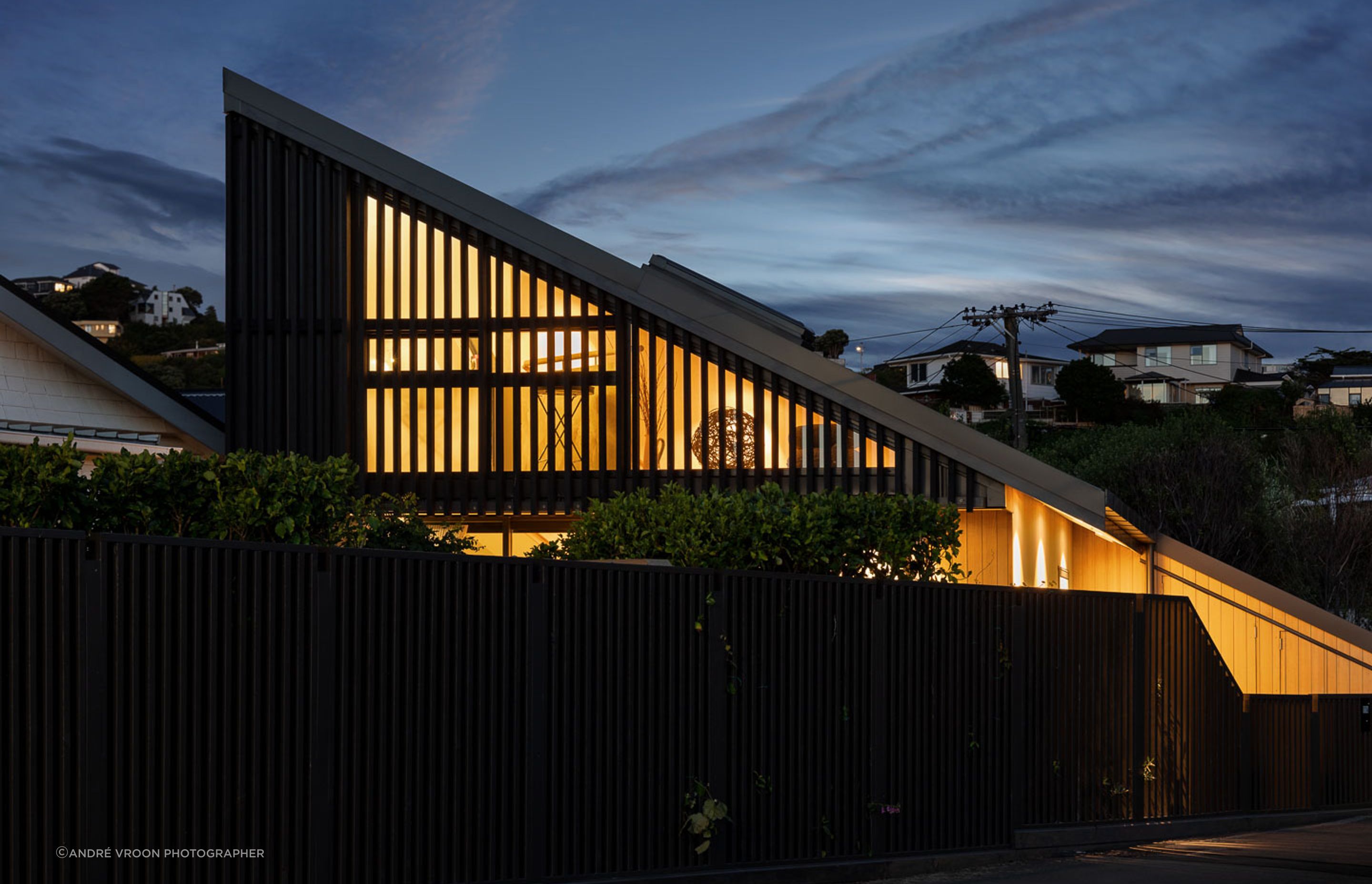 The sharp, angular shape of the home is dramatic when lit up at night.