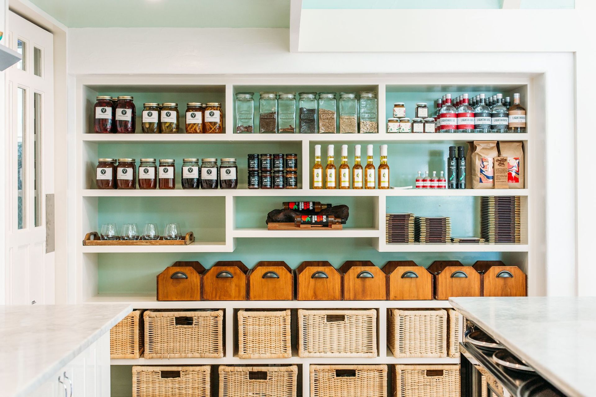 The scullery adjacent to the breakfast room and kitchen. Wharekauhau produces and sells its own honey, marmalade, gin and more.